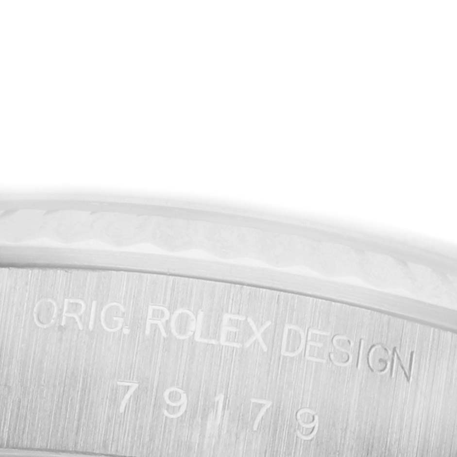 The image shows a close-up of the side of a Rolex President 79179 Women's White Gold Silver Dial 79179 Women's White Gold Silver Dial watch case, highlighting the engraved design and model number.