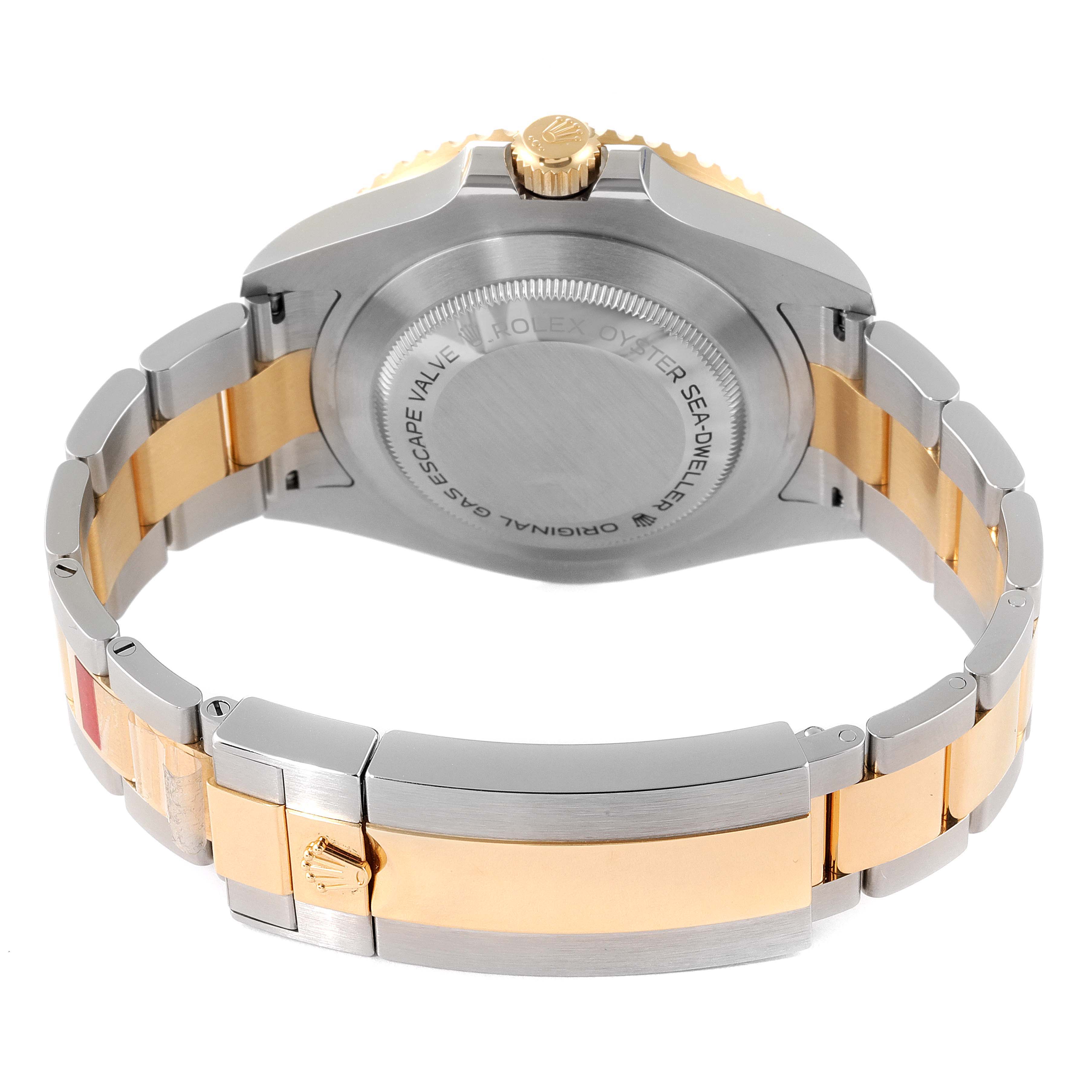 The image shows the back case, crown, and bracelet of a Rolex Sea-Dweller 126603 Men
s Steel and Gold (two tone) Black Dial 126603 Men
s Steel and Gold (two tone) Black Dial watch from a rear angle.
