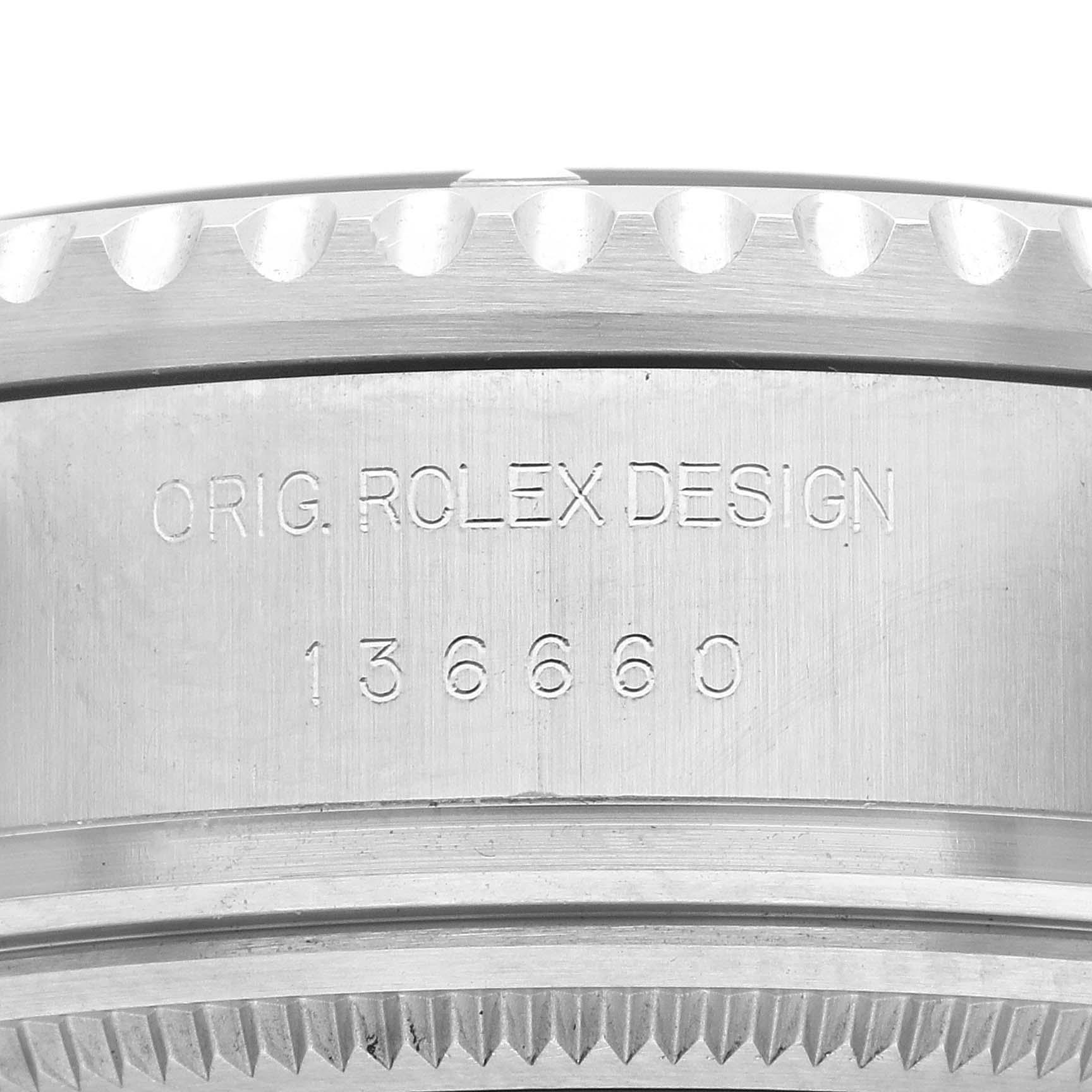 The image shows a close-up of the Rolex Sea-Dweller 136660 Men's Stainless Steel Black Dial 136660 Men's Stainless Steel Black Dial's case side, featuring engraved details and the model number.