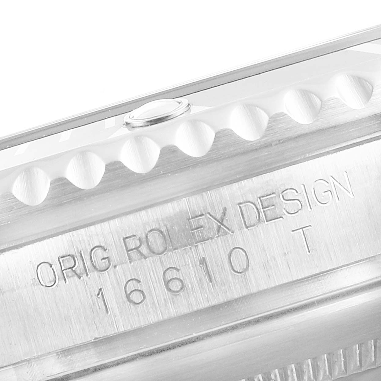 This image shows a close-up of the side engraving and bezel of a Rolex Submariner 16610 Men's Stainless Steel Black Dial 16610 Men's Stainless Steel Black Dial model 16610T.