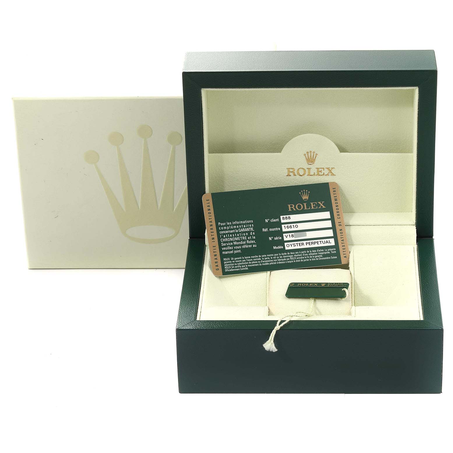 The image shows a Rolex Submariner 16610 Men
s Stainless Steel Black Dial 16610 Men
s Stainless Steel Black Dial box, warranty card, and accessories tray taken from a top-down angle.