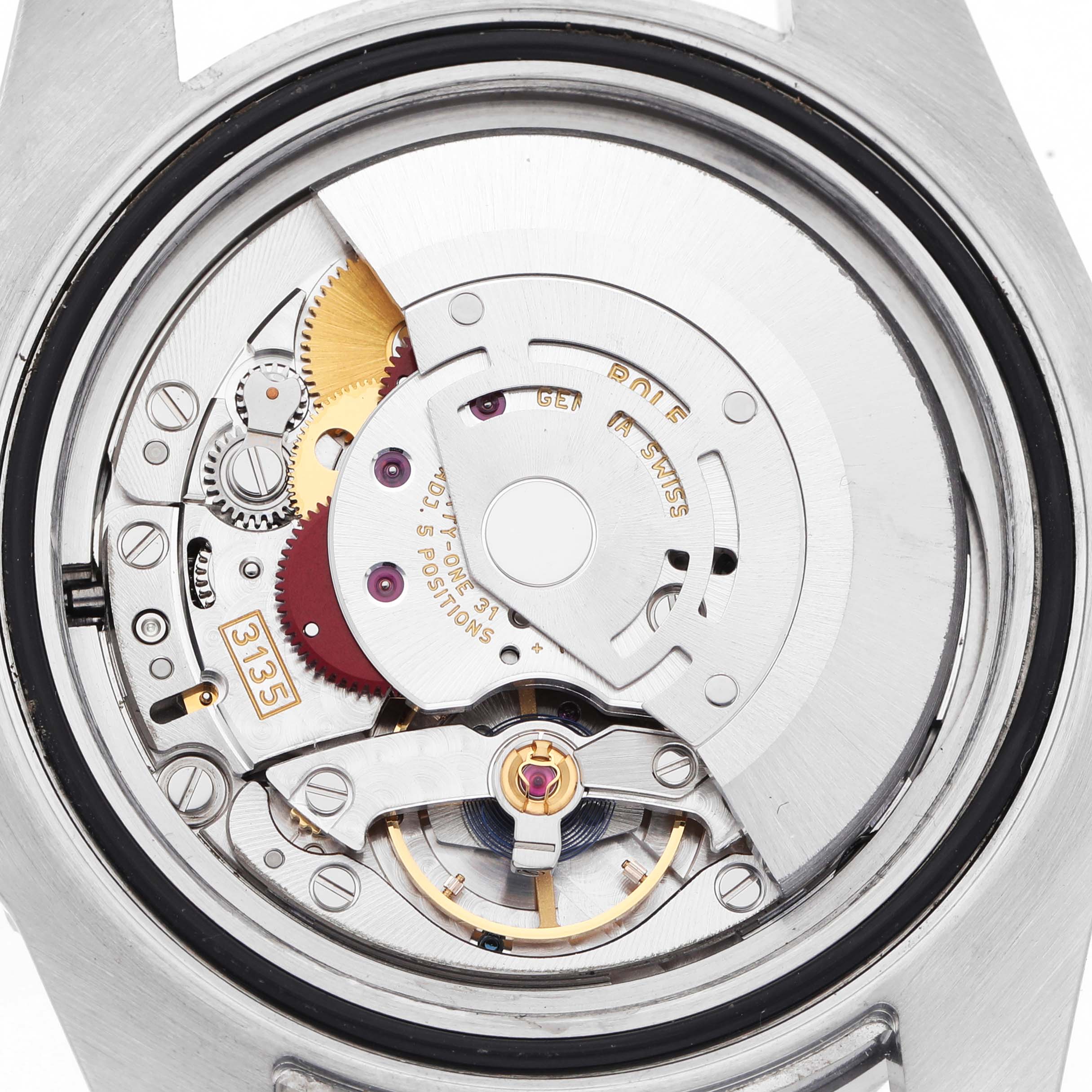 The image shows the movement of a Rolex Submariner 116610LN Men's Stainless Steel Black Dial watch from a back angle, highlighting gears and the oscillating weight.