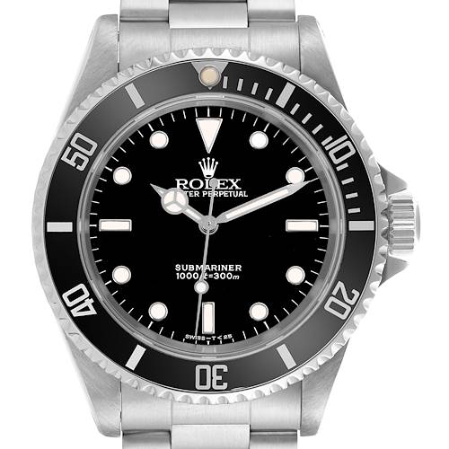 The Rolex Submariner watch is shown from a front angle, focusing on the black dial, bezel, and stainless steel bracelet.