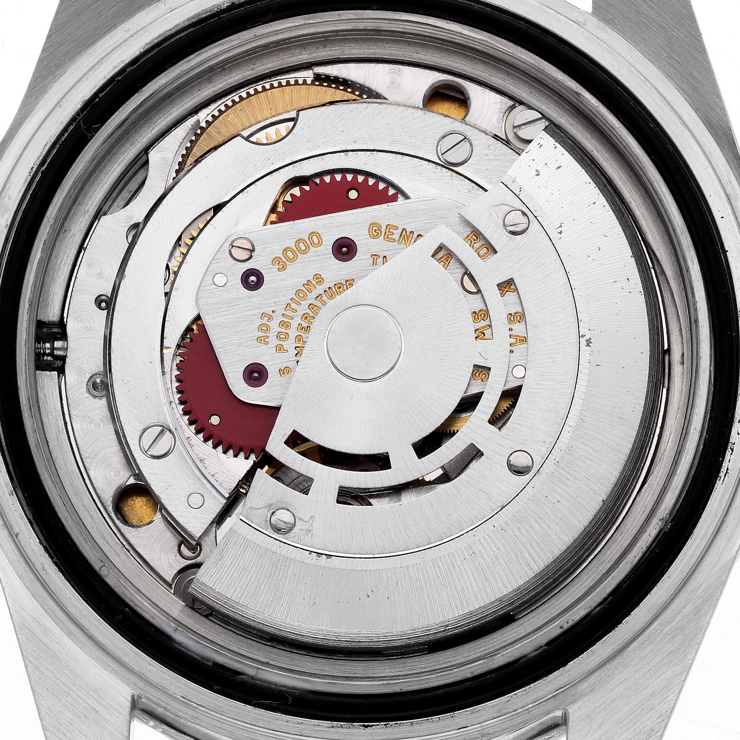 The image shows the movement of a Rolex Submariner 14060 Men's Stainless Steel Black Dial 14060 Men's Stainless Steel Black Dial watch from a back, internal angle, highlighting its intricate components.