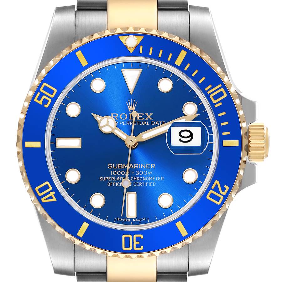 The Rolex Submariner is shown from the front, displaying its blue dial, date window, bezel, and part of the bracelet.