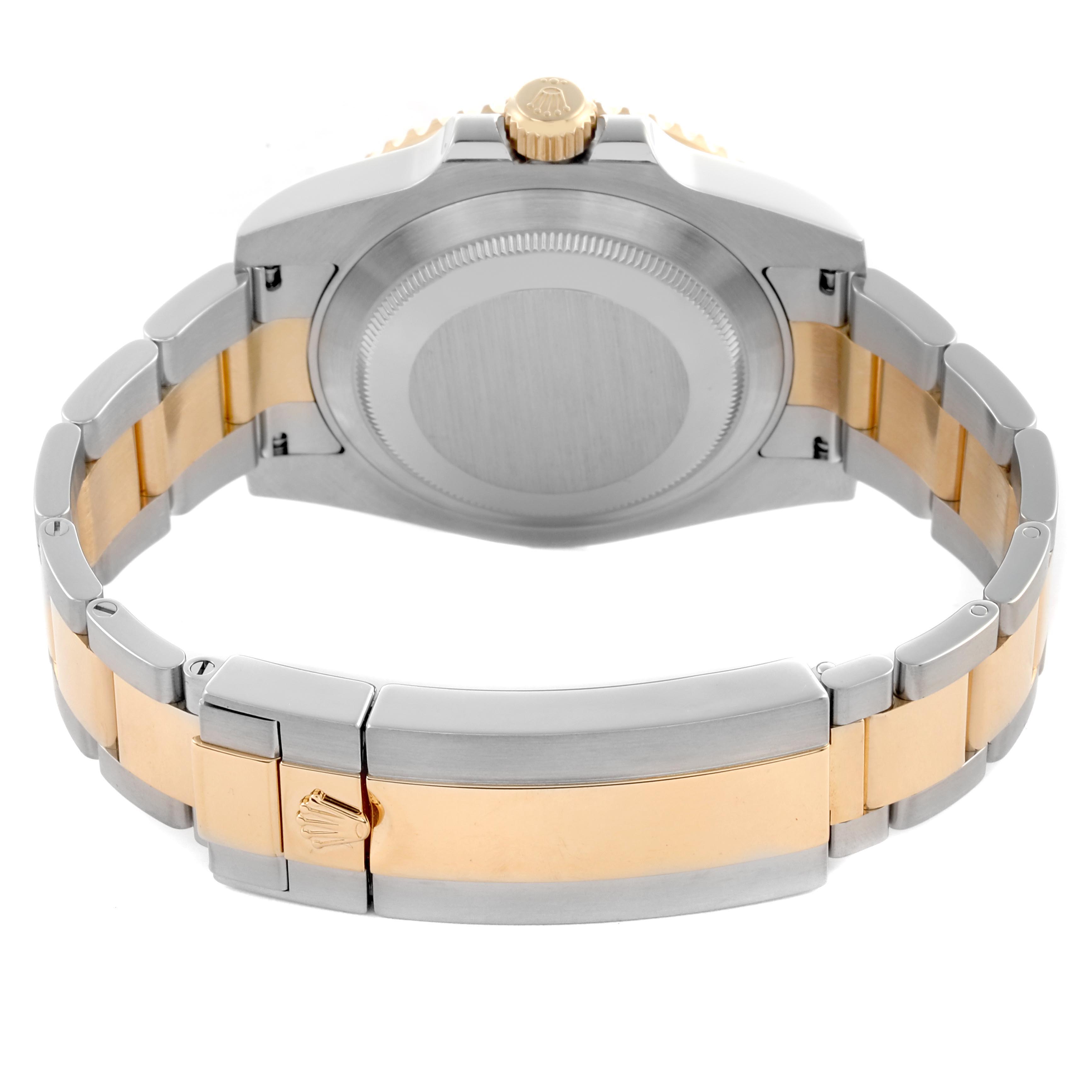 The Rolex Submariner 116613LB Men's Steel and Gold (two tone) Blue Dial 116613LB Men's Steel and Gold (two tone) Blue Dial watch is shown from the back, highlighting the case back, crown, and dual-tone bracelet.