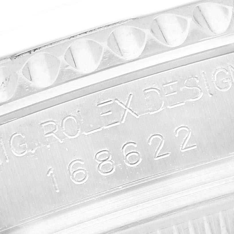 The image shows a close-up of the bezel and engraved serial number on the Rolex Yacht-Master 168622 Men
s Stainless Steel Silver Dial 168622 Men
s Stainless Steel Silver Dial watch.