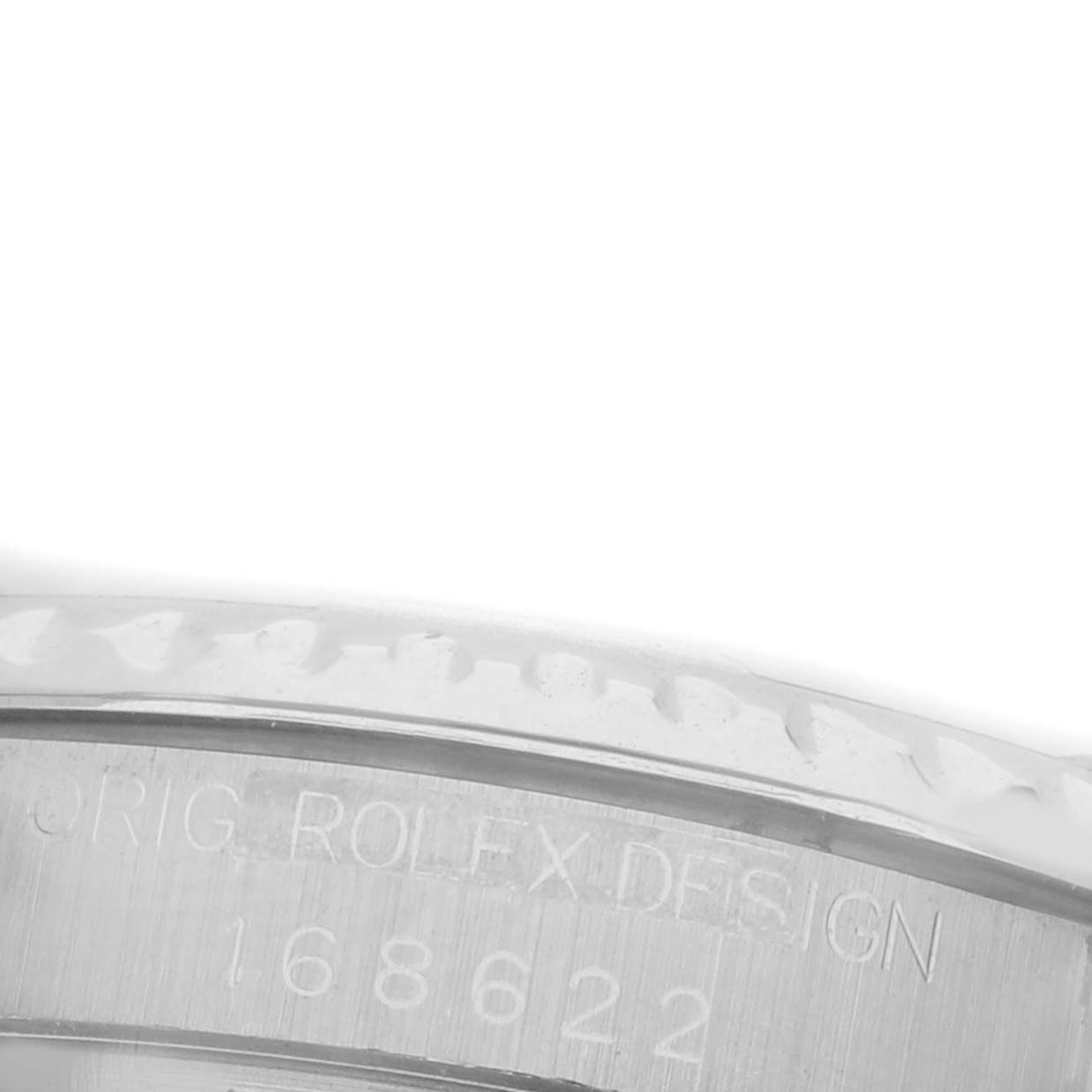 The image shows a close-up of the edge of the Rolex Turn-o-Graph 168622 Men's Stainless Steel Silver Dial 168622 Men's Stainless Steel Silver Dial bezel, engraved with model details.