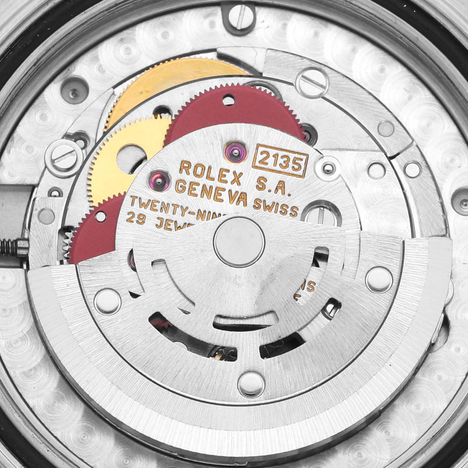 The image shows the movement of the Rolex Yacht-Master 68623 Men's Steel and Gold (two tone) Mother of Pearl Dial 68623 Men's Steel and Gold (two tone) Mother of Pearl Dial, displaying gears and the rotor from a top-down angle.