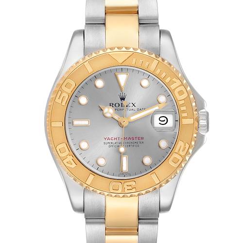 The Rolex Yacht-Master watch is shown from a top-down angle, highlighting its gold and silver bezel, dial, hands, and bracelet.