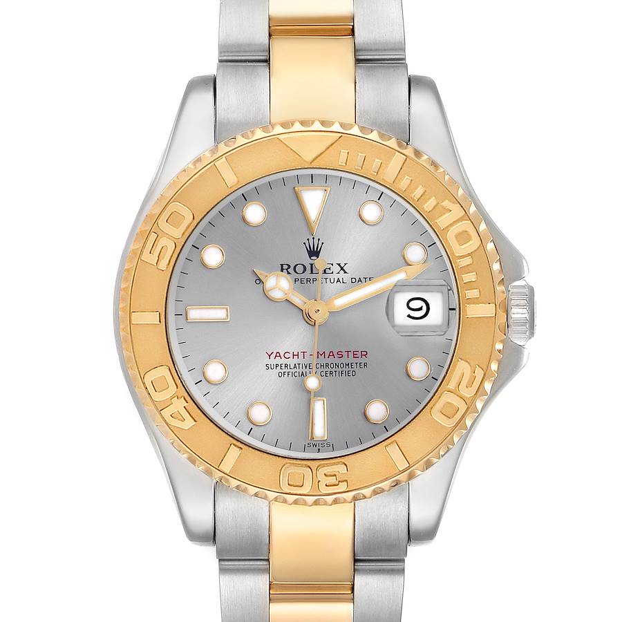 The Rolex Yacht-Master watch is shown from a top-down angle, highlighting the dial, bezel, and bracelet.