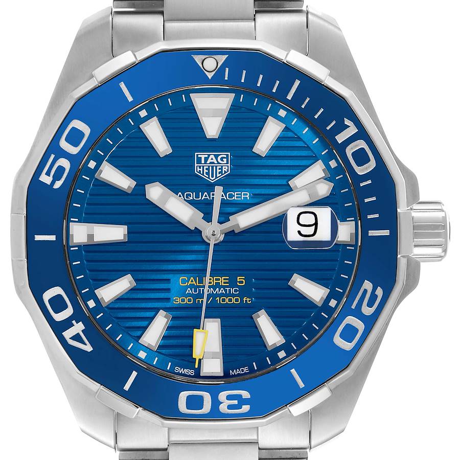 The Tag Heuer Aquaracer watch is shown from the front, displaying its blue dial, bezel, and metal bracelet.