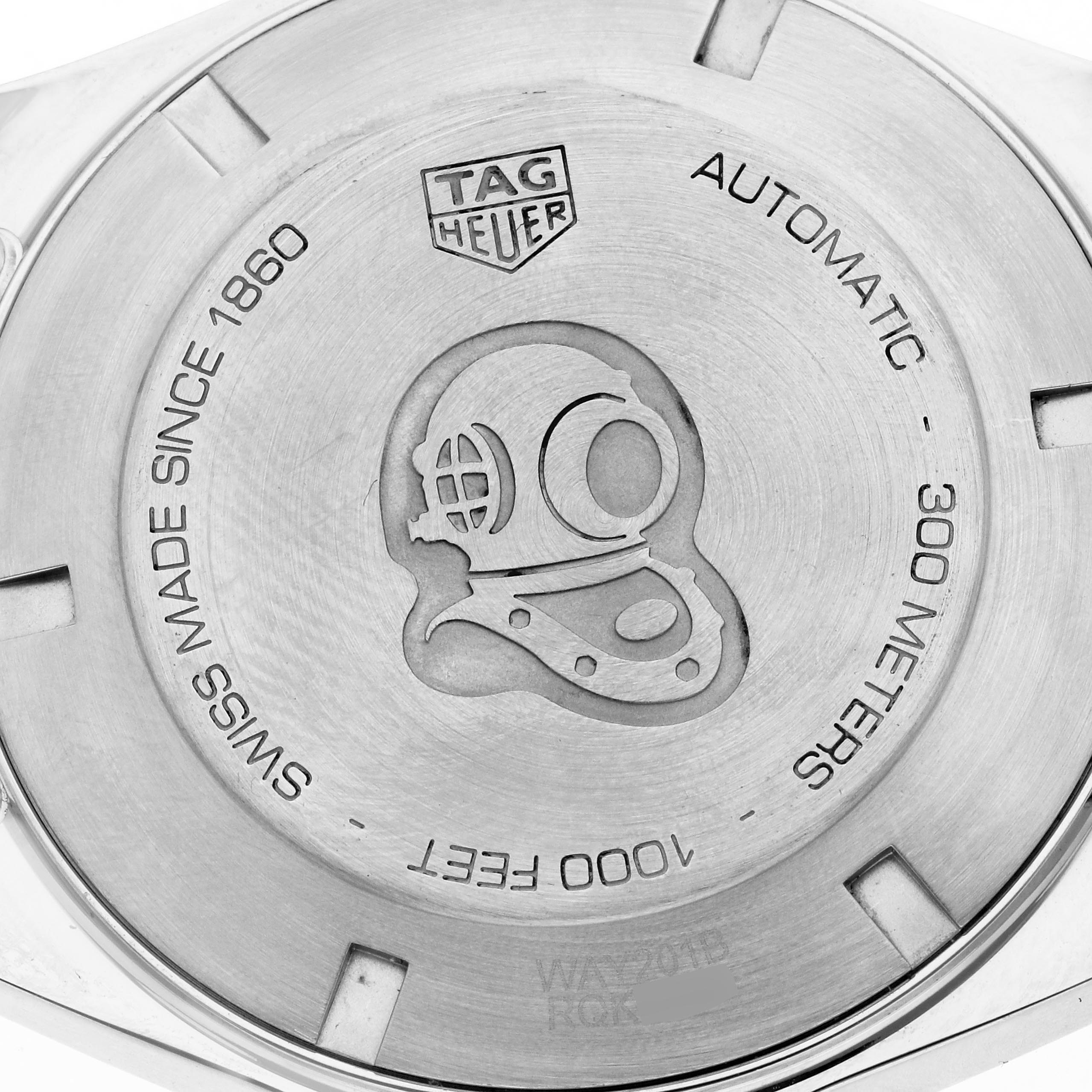 The image shows the case back of a Tag Heuer Aquaracer WAY201B.BA0927 Men's Stainless Steel Blue Dial WAY201B.BA0927 Men's Stainless Steel Blue Dial watch, featuring engravings and a diver helmet design.