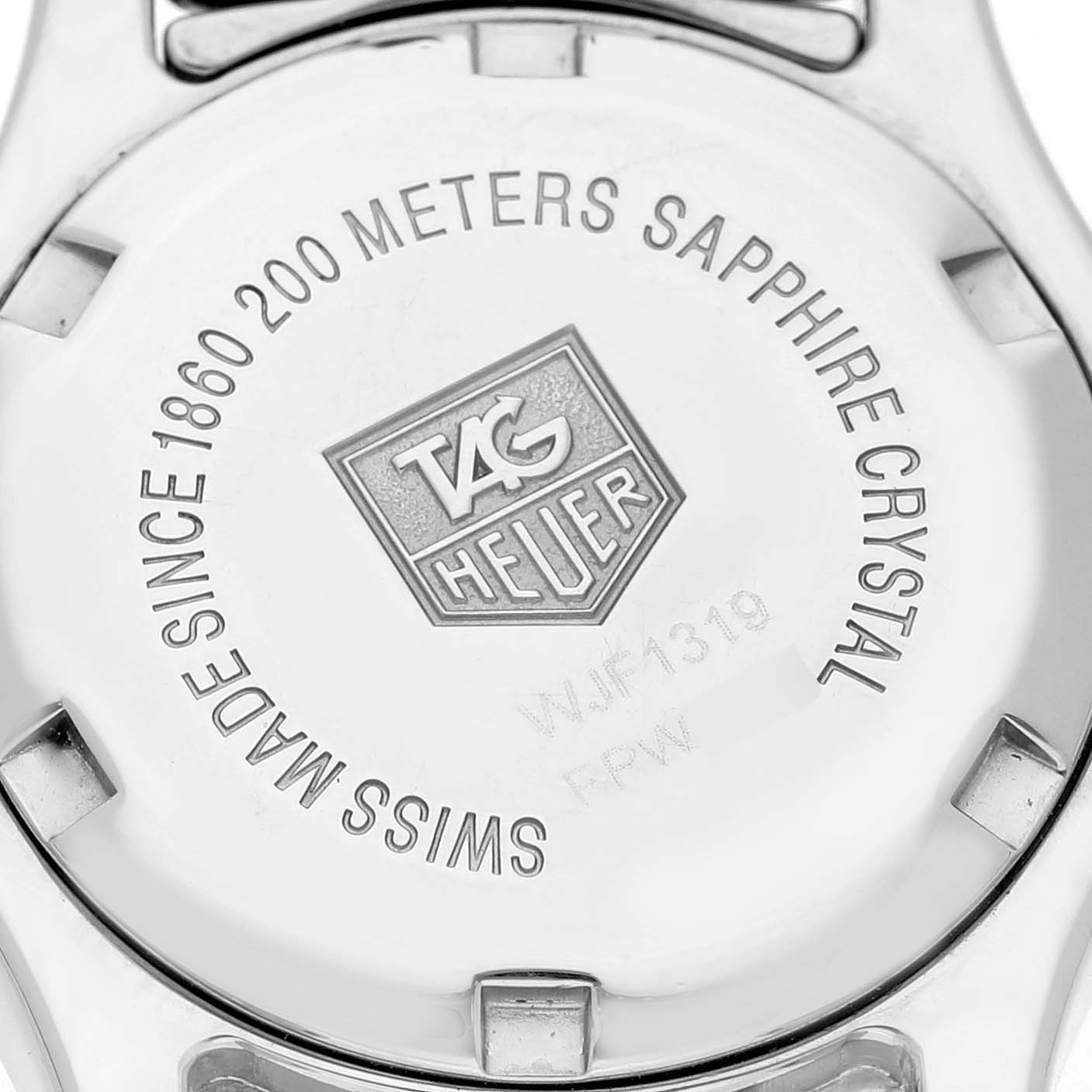 The image shows the back case of a Tag Heuer Link WJF1319.BA0572 Women's Stainless Steel Mother of Pearl Dial watch, highlighting branding and specifications.