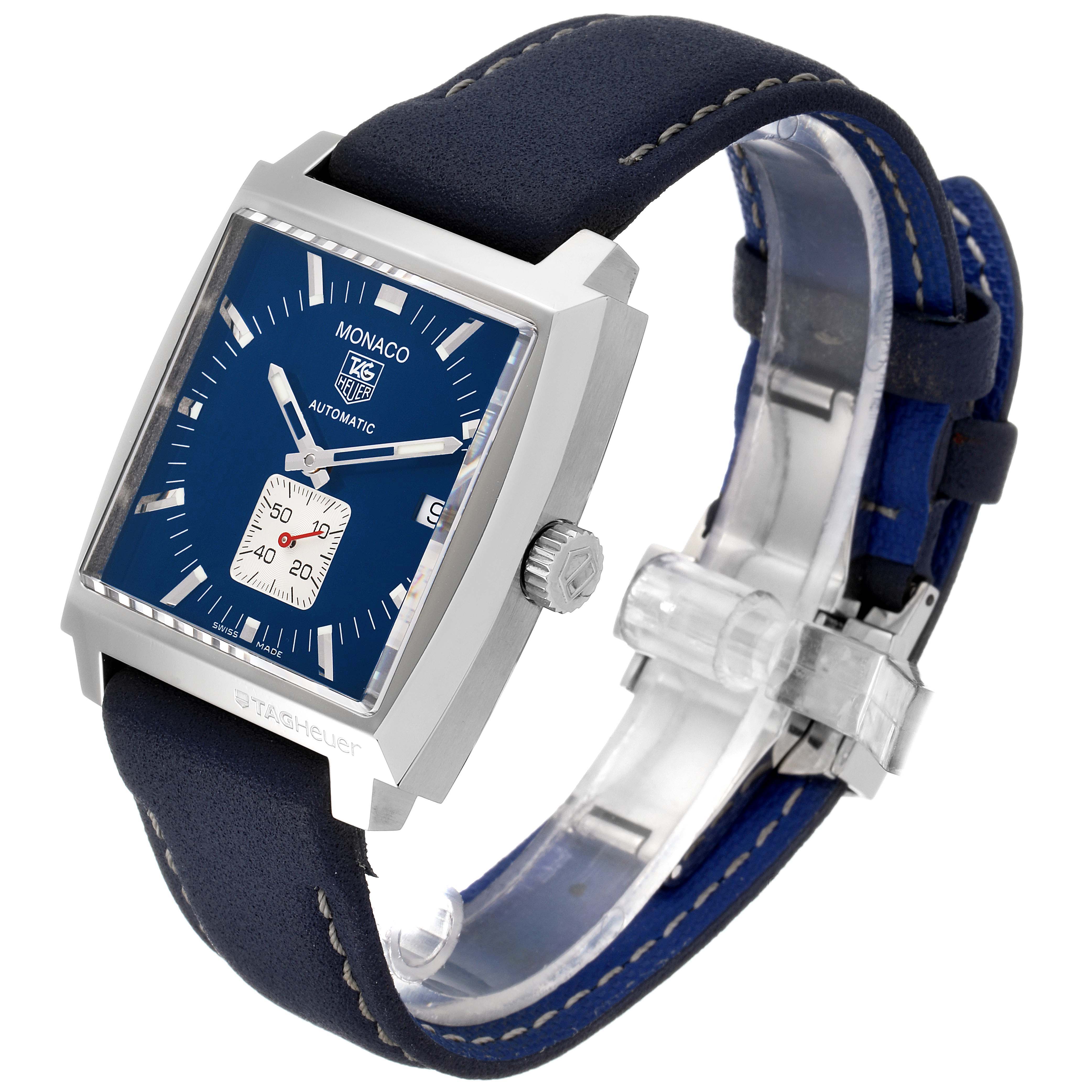 The image shows a side-angle view of the Tag Heuer Monaco WW2111.FC6204 Men's Stainless Steel Blue Dial WW2111.FC6204 Men's Stainless Steel Blue Dial watch, highlighting its blue square face, crown, and strap.
