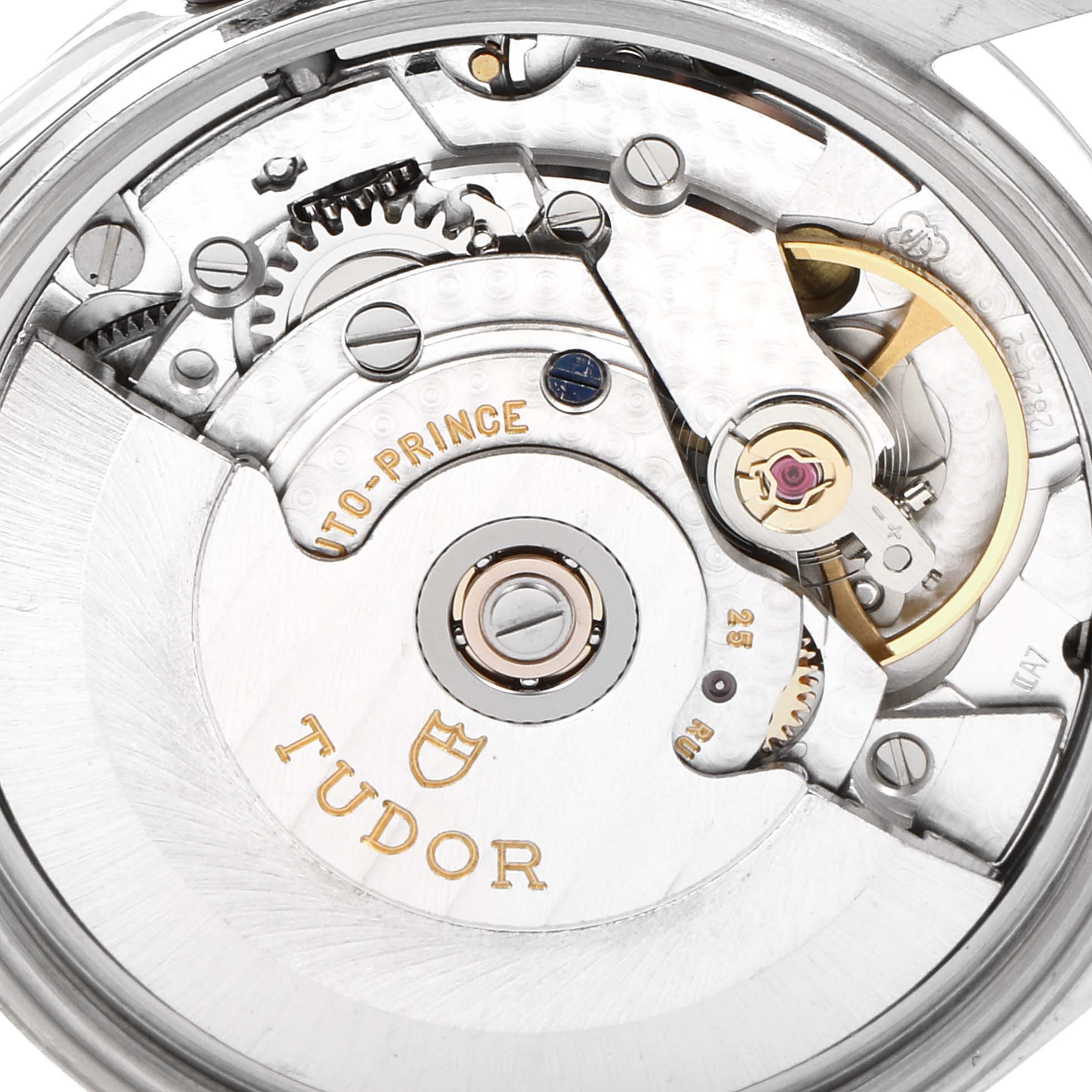 The image shows the inner mechanical movement of a Tudor Prince 72000 Men's Stainless Steel Black Dial 72000 Men's Stainless Steel Black Dial watch, highlighting gears and the balance wheel.