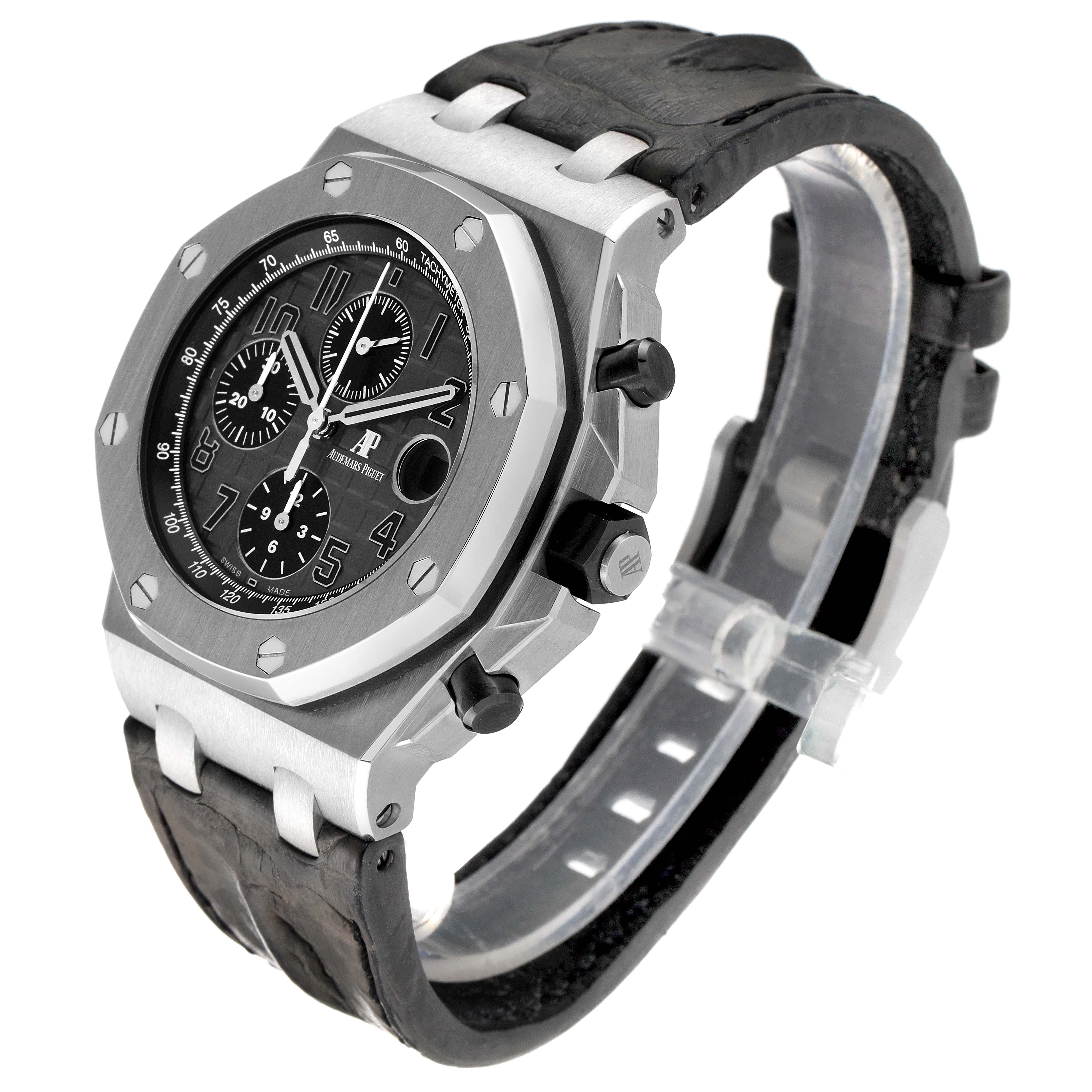 The image shows an Audemars Piguet Royal Oak Offshore 26470ST.OO.A104CR.01 Men's Stainless Steel Grey Dial 26470ST.OO.A104CR.01 Men's Stainless Steel Grey Dial watch with a black dial, chronograph subdials, and a leather strap at a three-quarter angle.