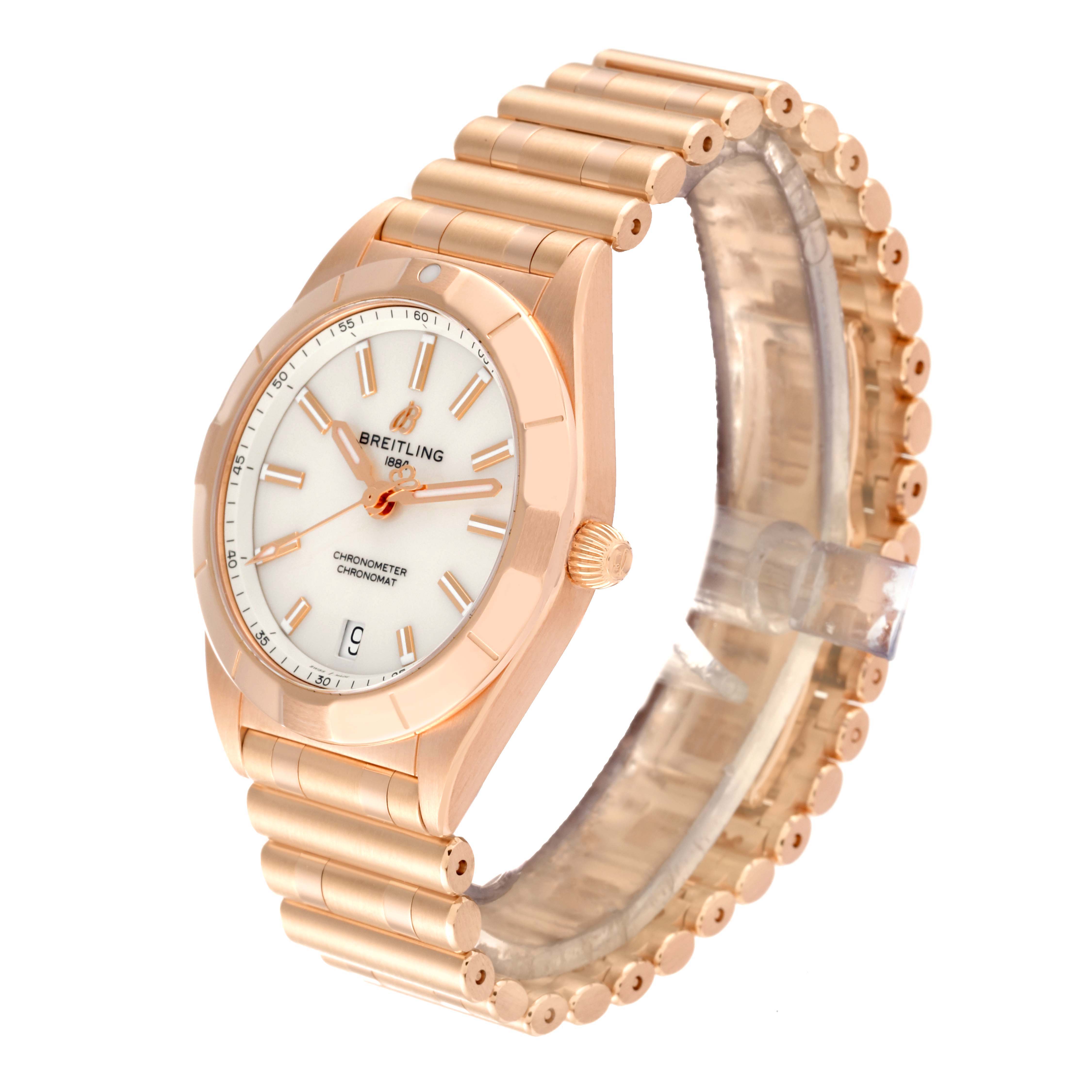 The Breitling R77310101A1R1 Women's Rose Gold White Dial R77310101A1R1 Women's Rose Gold White Dial Chronomat 32 White Dial Rose Gold Ladies Watch R77310 is shown at a 3/4 angle, displaying the watch face, bezel, and bracelet.