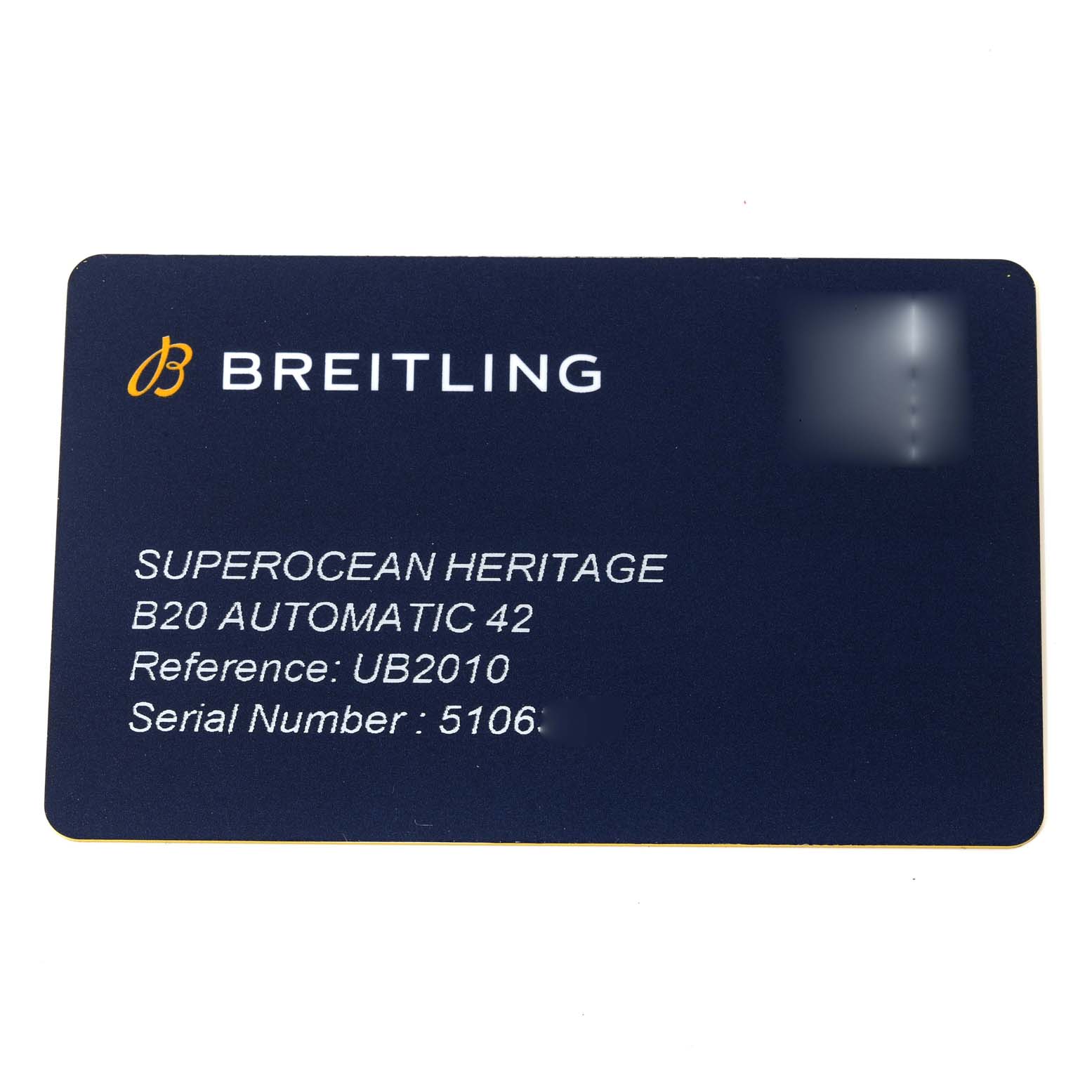 The image shows a warranty card for the Breitling Superocean UB2010 Men's Steel and Gold (two tone) Black Dial UB2010 Men's Steel and Gold (two tone) Black Dial Heritage B20 Automatic 42 watch, displaying model and serial numbers.