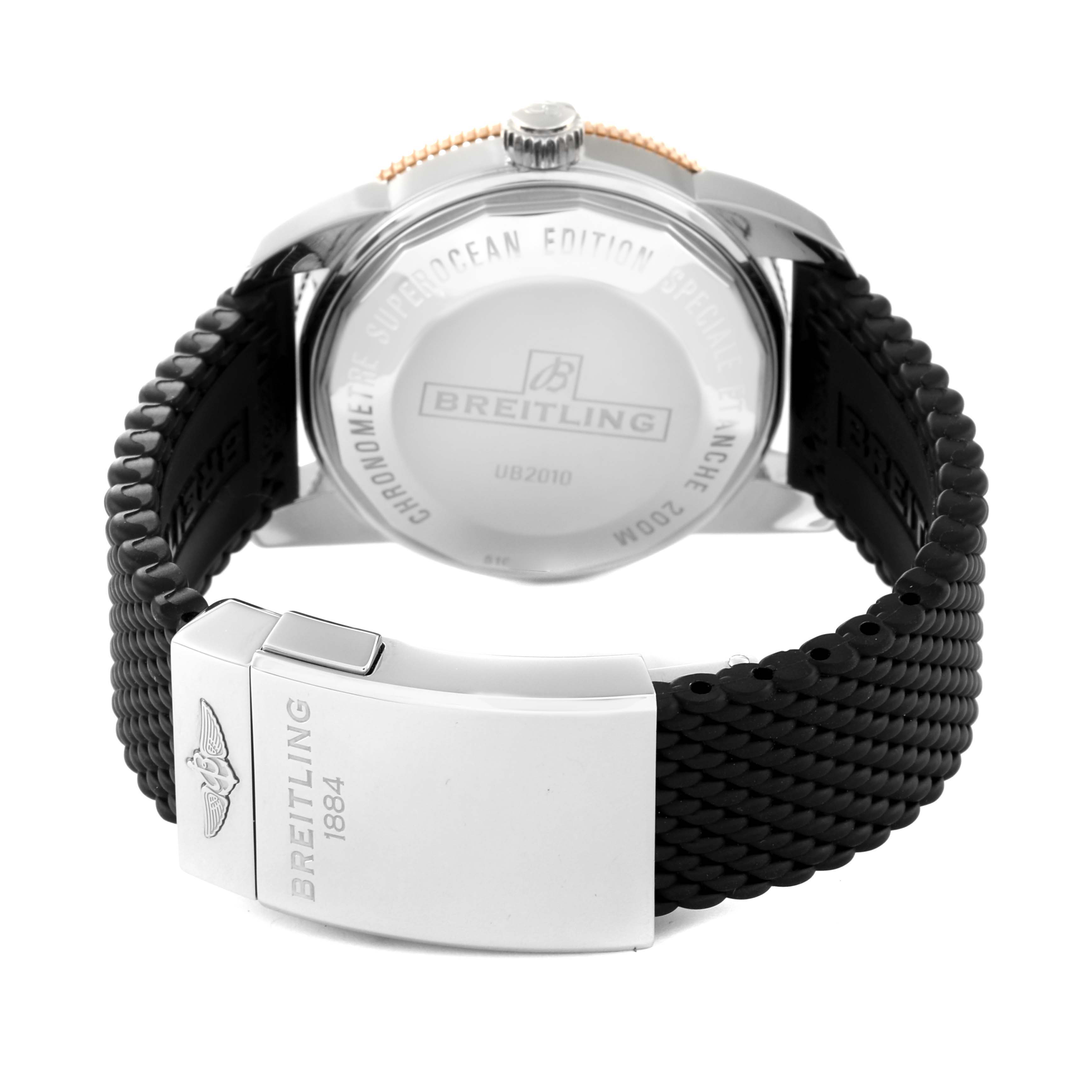 This image shows the back of the Breitling Superocean UB2010 Men's Steel and Gold (two tone) Black Dial UB2010 Men's Steel and Gold (two tone) Black Dial watch, featuring its clasp and the rear case with branding.
