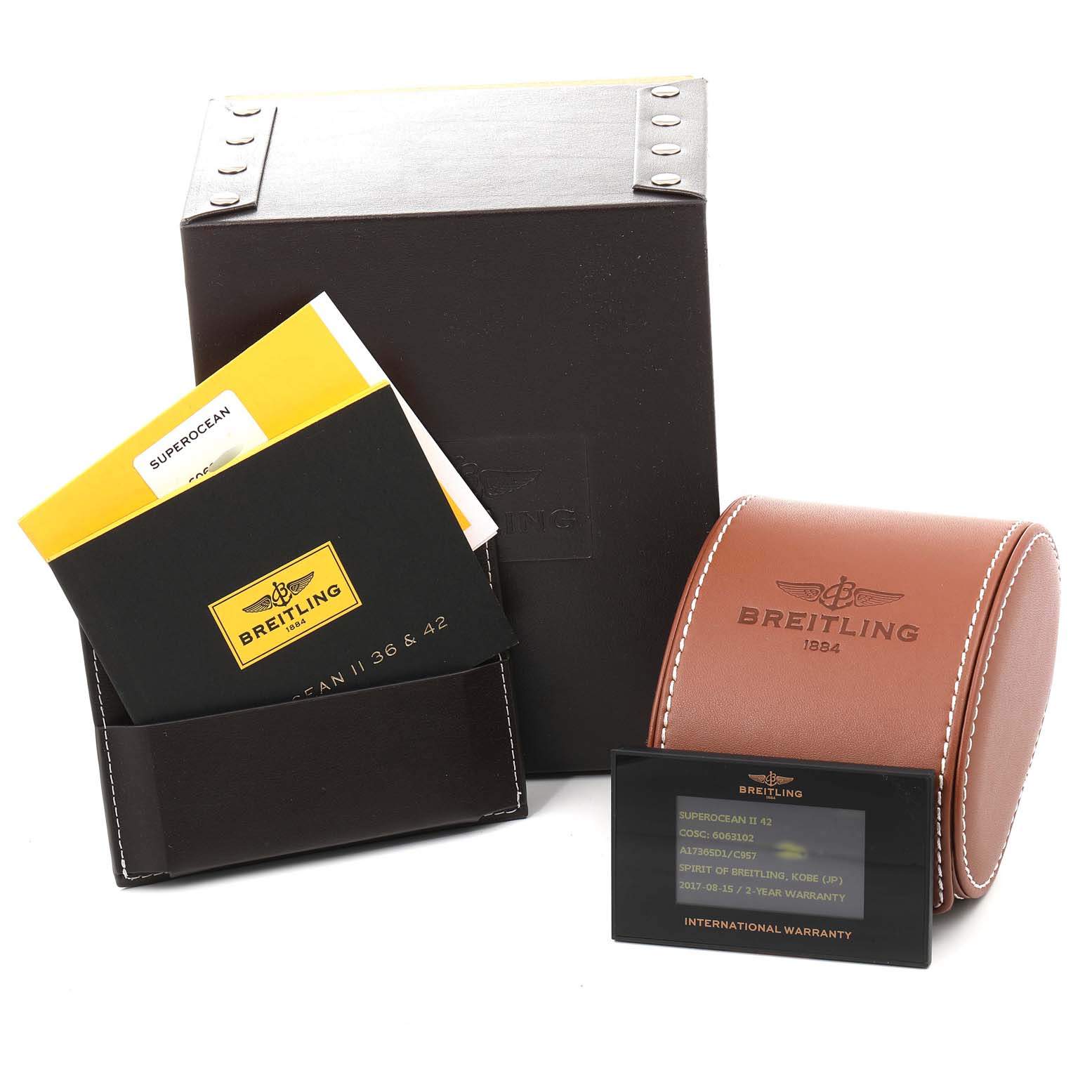 The image shows the packaging, warranty card, and manuals for the Breitling Superocean A17365 Men's Stainless Steel Blue Dial A17365 Men's Stainless Steel Blue Dial watch.