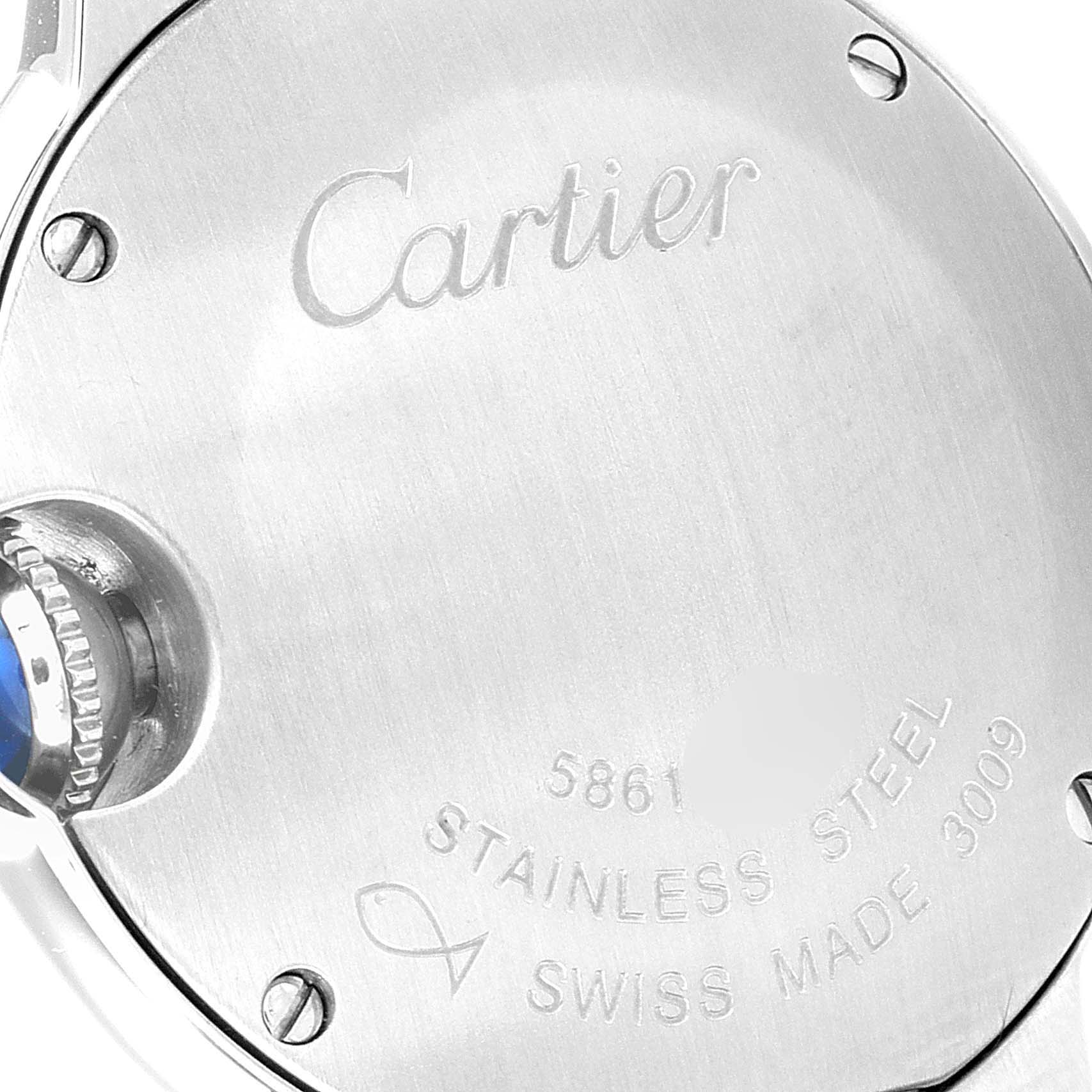 This image shows the back case of a Cartier Ballon Bleu W4BB0015 Women
s Stainless Steel Silver Dial W4BB0015 Women
s Stainless Steel Silver Dial watch, highlighting the engraving, screws, and part of the crown.