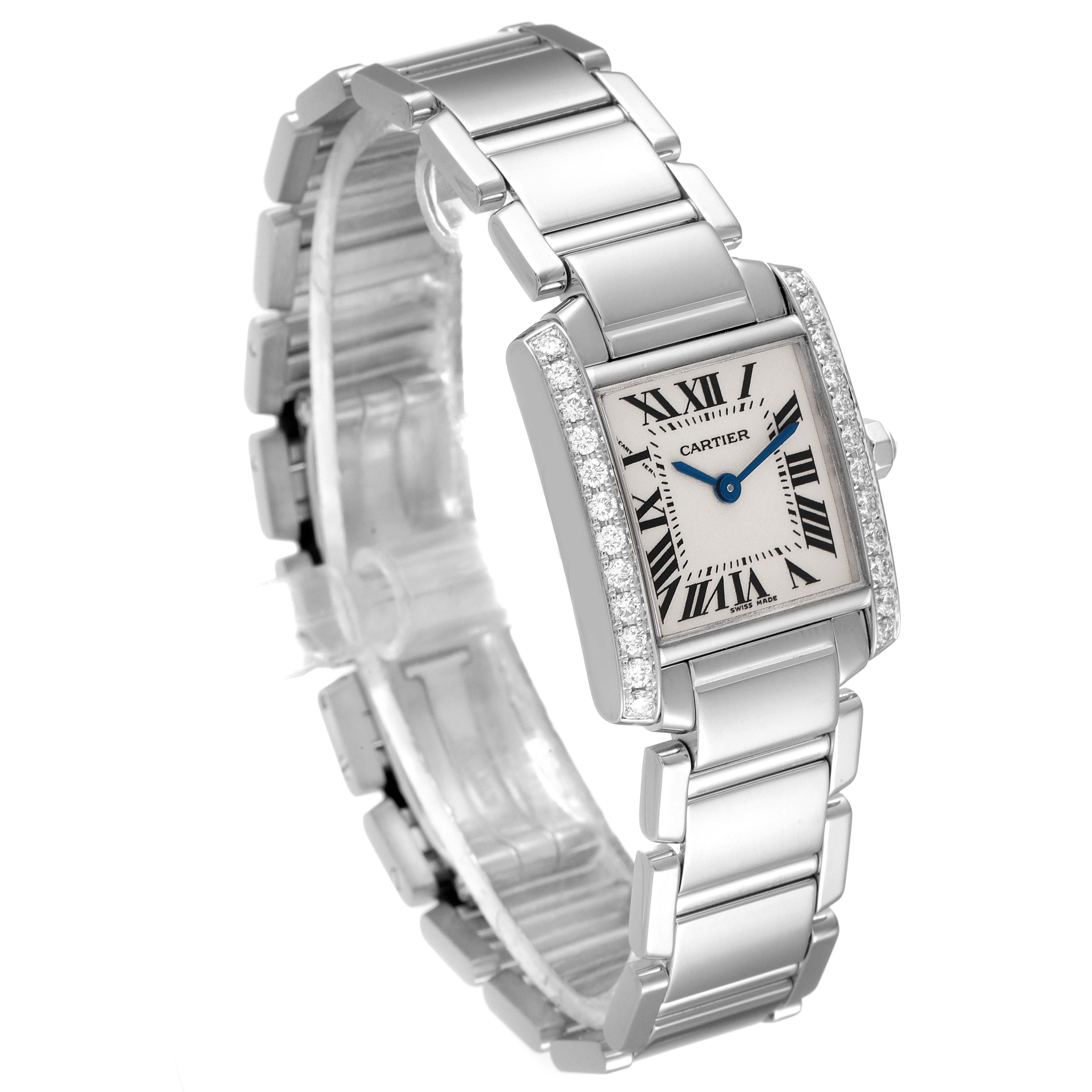 The image shows a Tank Française model by Cartier from a front-side angle, highlighting the face, bracelet, and the diamond-encrusted bezel.