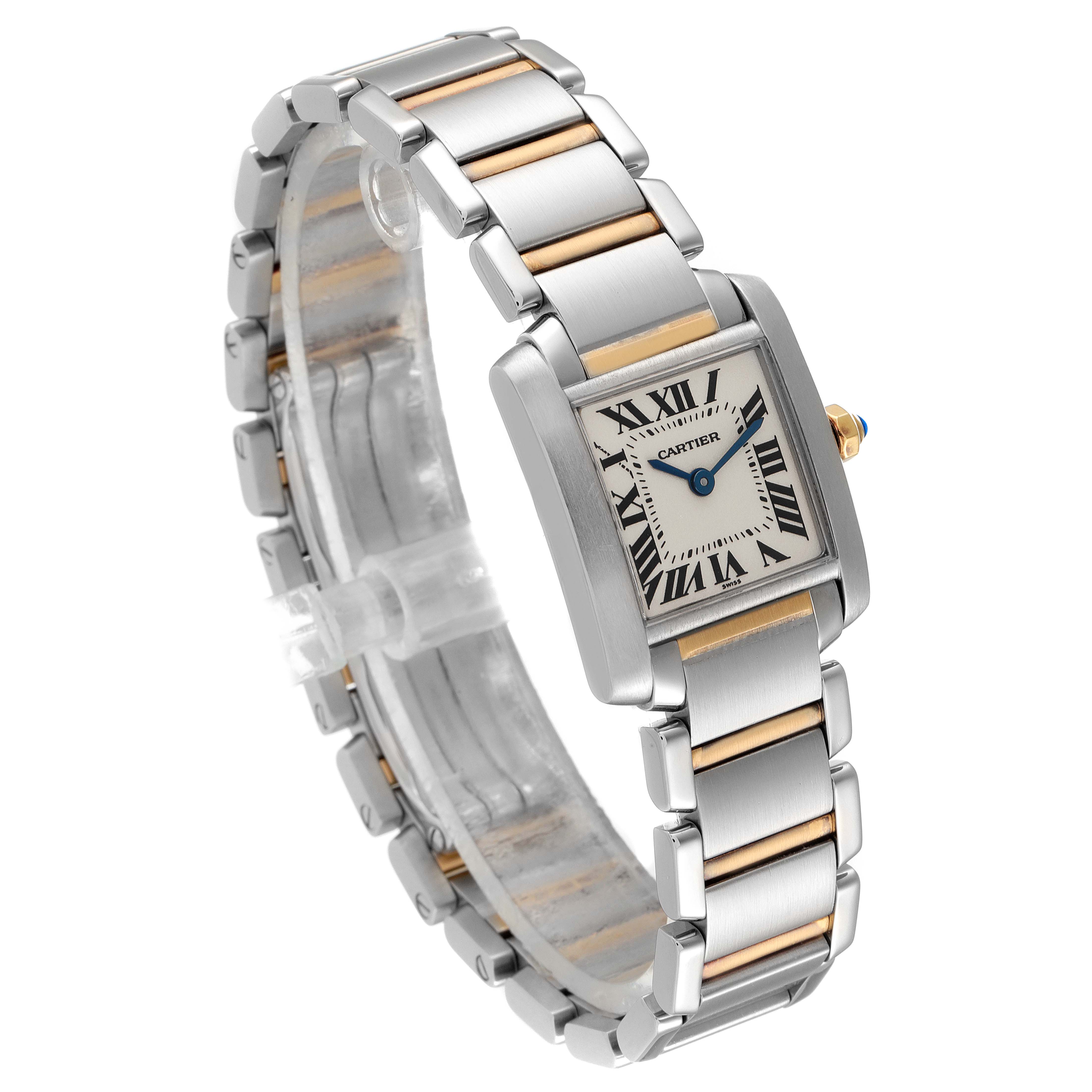 The Cartier Tank Française watch is shown at an oblique angle, displaying its rectangular face and two-tone metal bracelet.