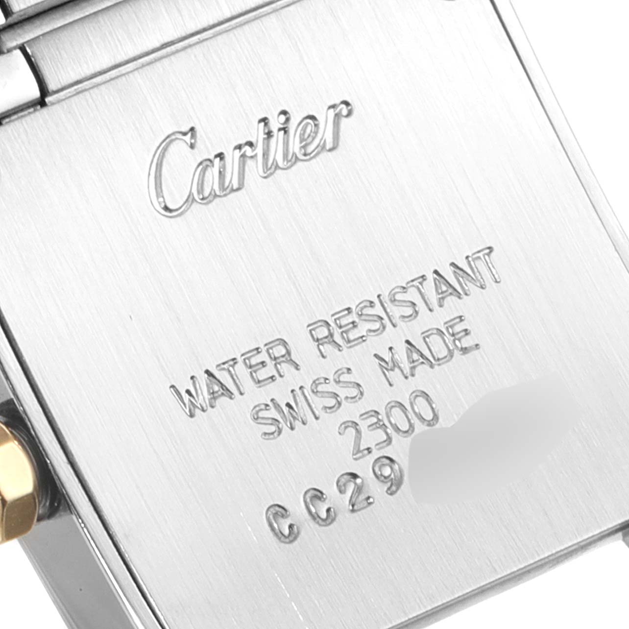 This image shows the back clasp of a Cartier Tank Française watch, highlighting its engraved details.