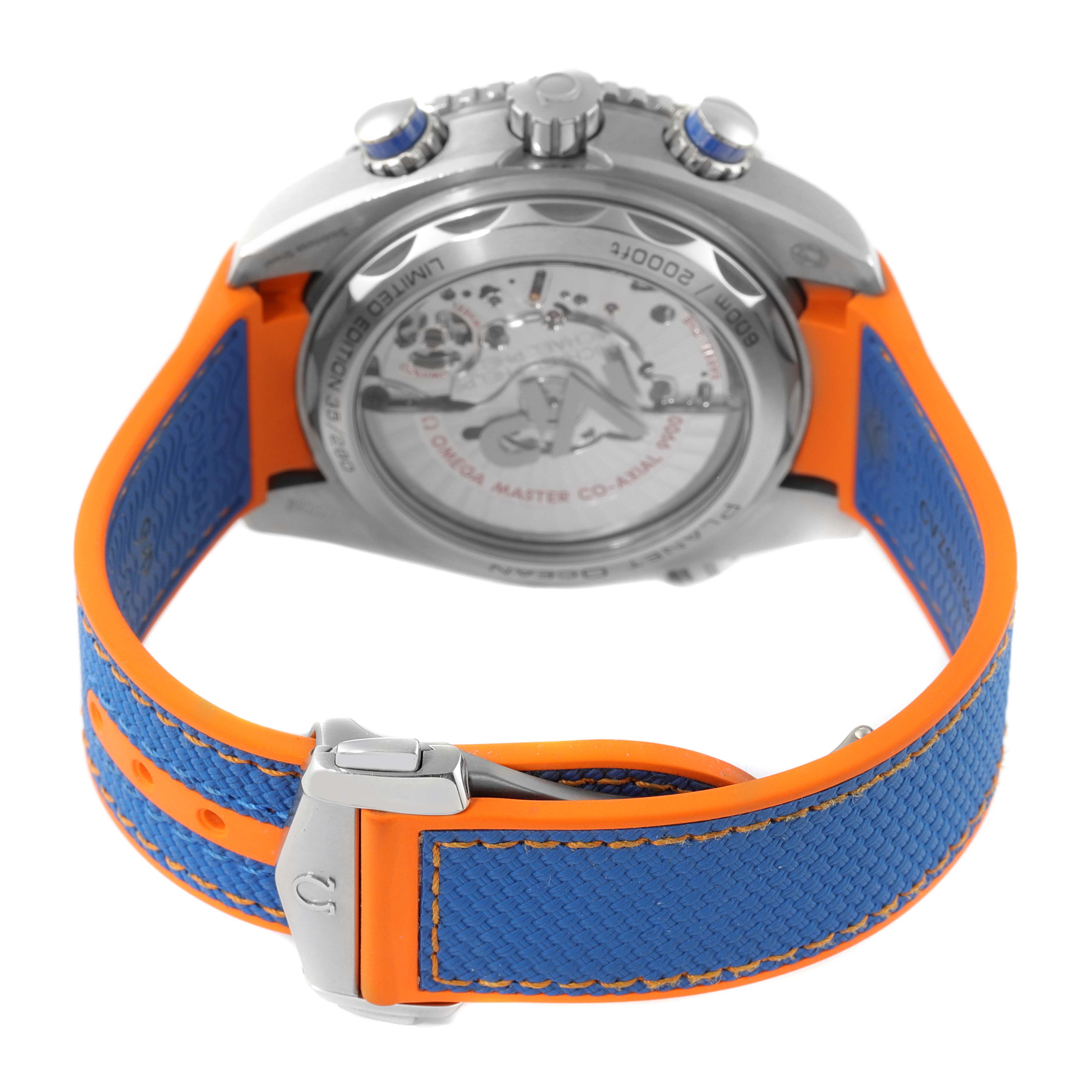 The image shows the back view of an Omega Planet Ocean 215.32.46.51.04.001 Men's Stainless Steel White Dial 215.32.46.51.04.001 Men's Stainless Steel White Dial watch, focusing on the case back and the blue and orange strap.