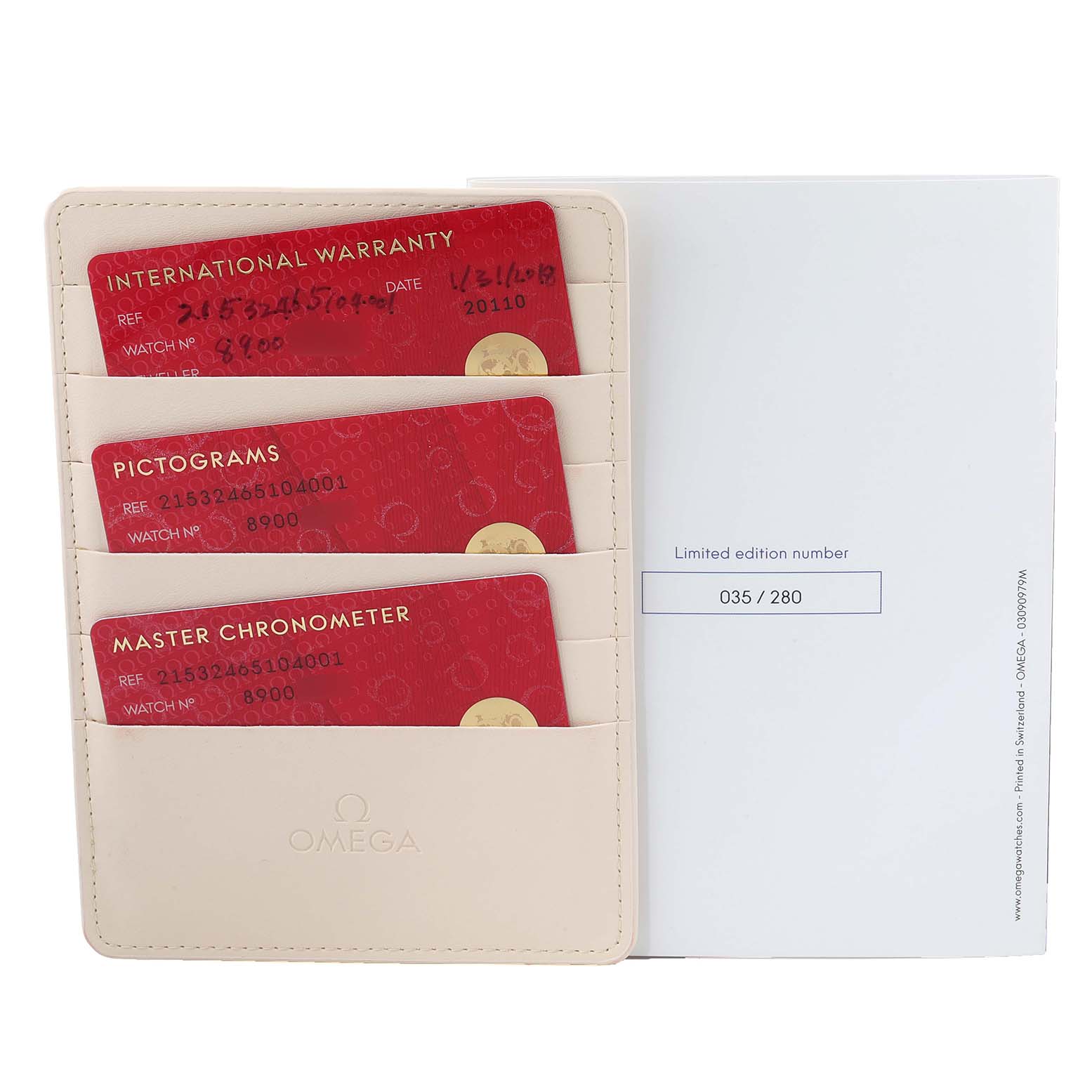 This image shows the warranty cards and documentation for the Omega Planet Ocean 215.32.46.51.04.001 Men's Stainless Steel White Dial 215.32.46.51.04.001 Men's Stainless Steel White Dial model, including an international warranty, pictograms, and master chronometer cards.