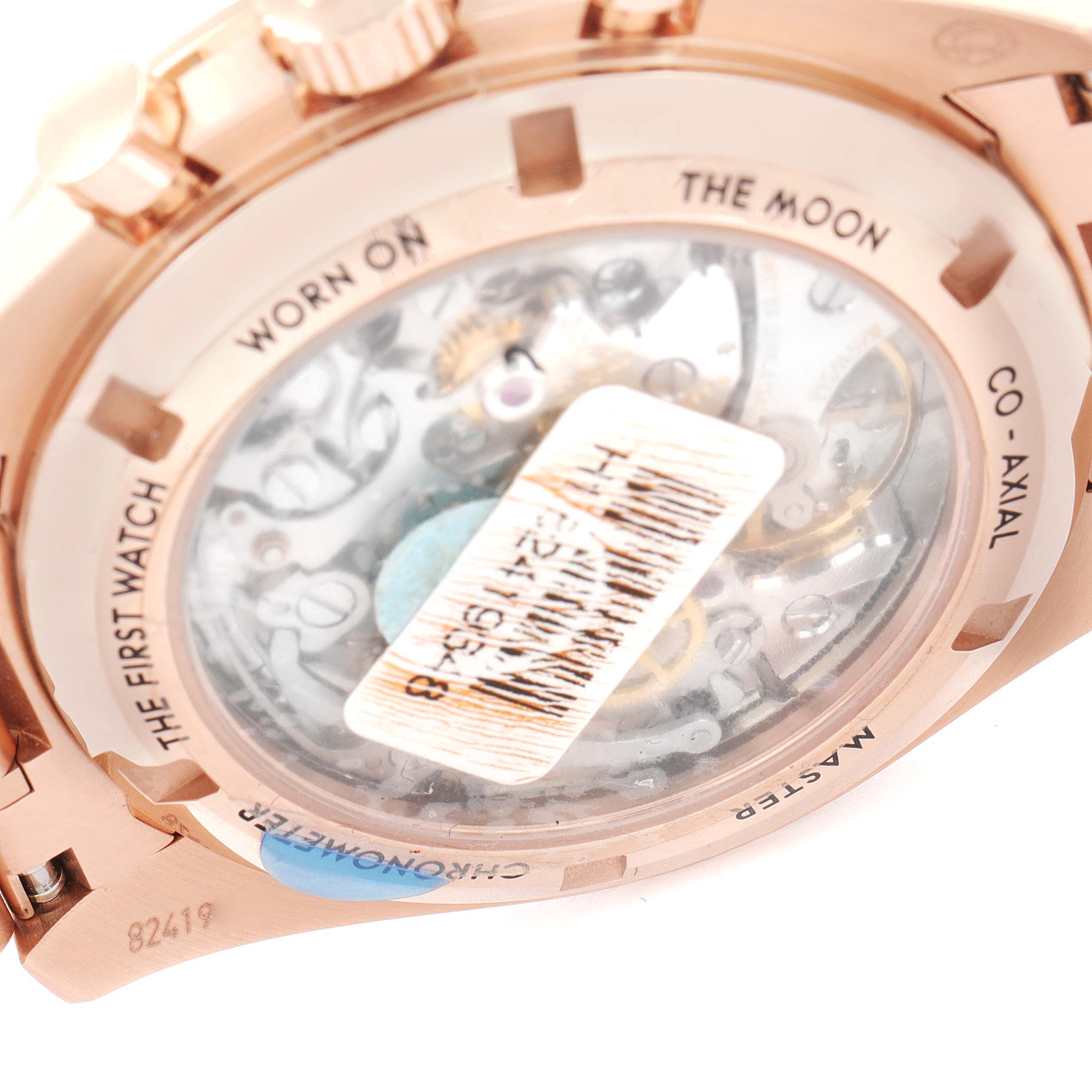 This image shows the case back of the Omega Speedmaster 310.60.42.50.01.001 Men's Rose Gold Black Dial 310.60.42.50.01.001 Men's Rose Gold Black Dial watch, highlighting the movement through the transparent cover.