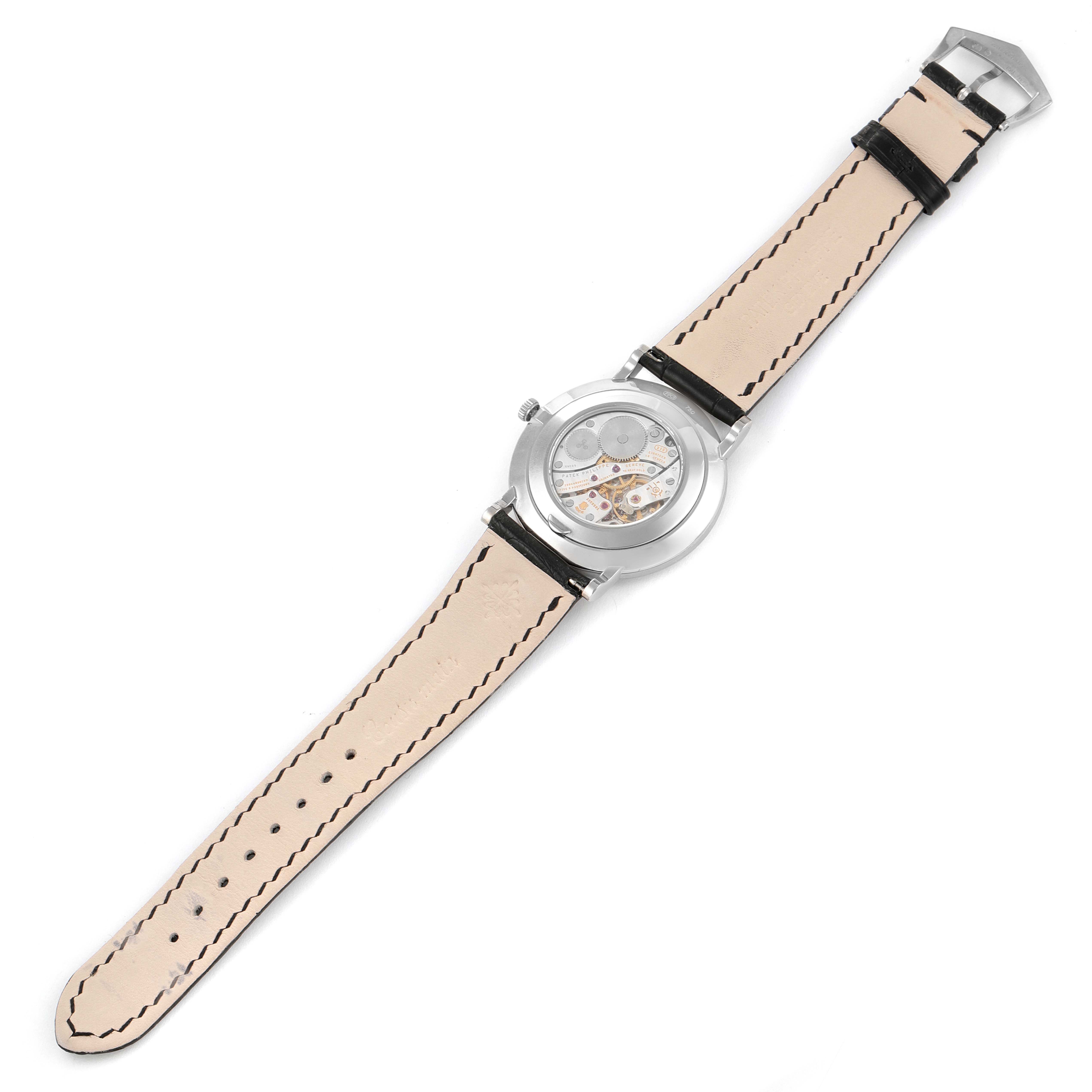 The image shows the back of a Patek Philippe Calatrava 5116G Men's White Gold White Dial 5116G Men's White Gold White Dial watch, highlighting its leather strap and movement.