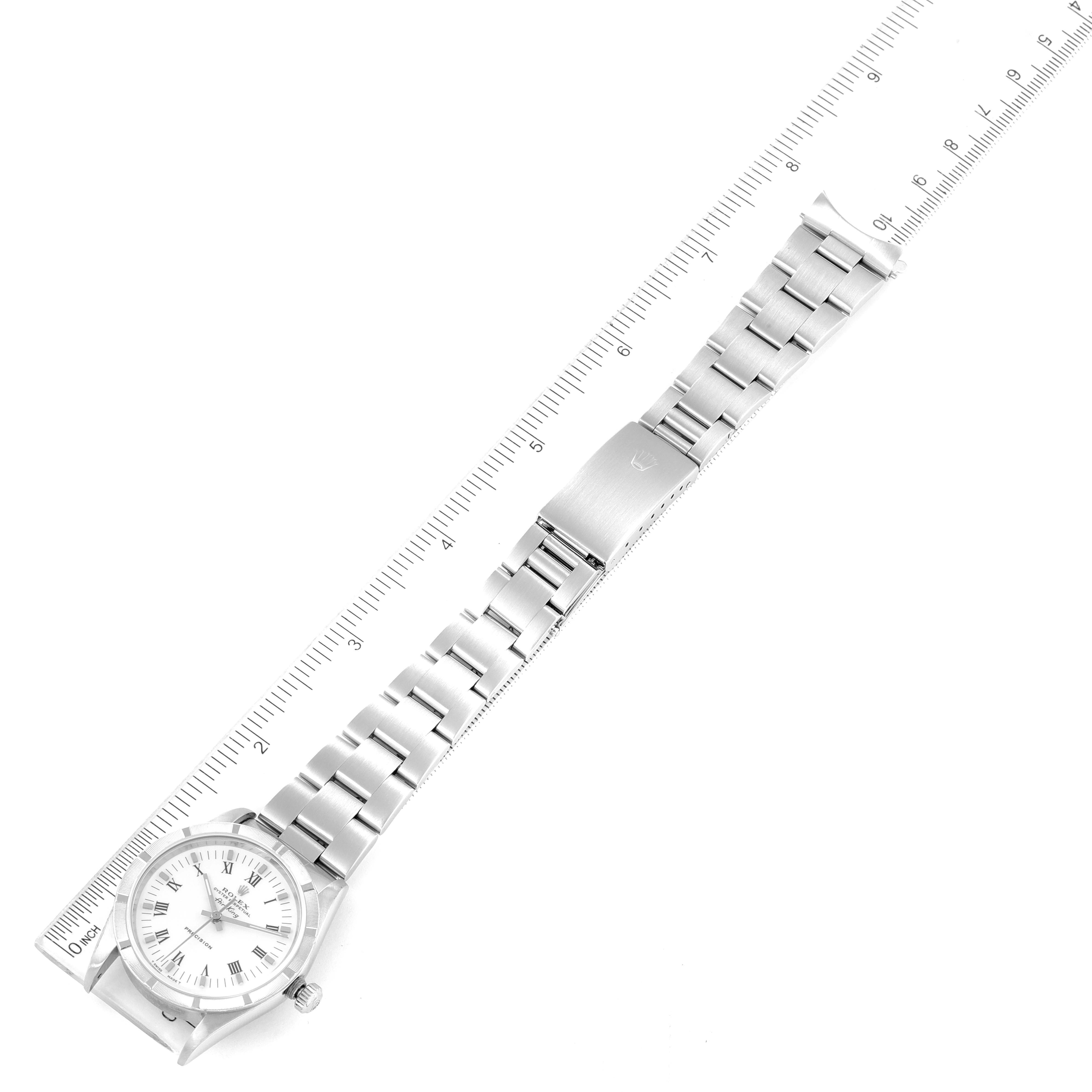 The Rolex Air-King 14010 Men's Stainless Steel White Dial 14010 Men's Stainless Steel White Dial watch is shown flat, displaying the full face, bracelet, and clasp next to a ruler for scale.