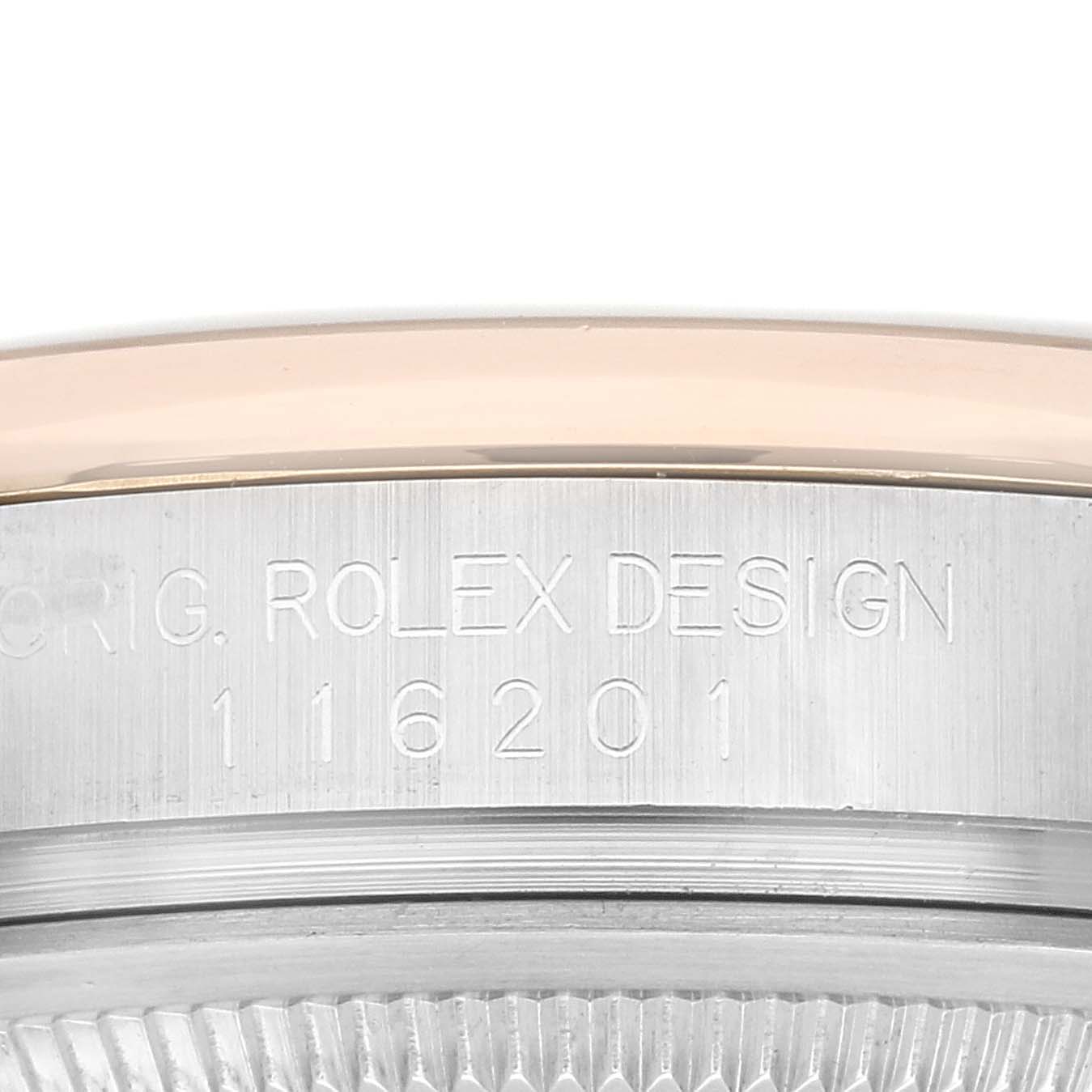 This image shows the engraved side of the case body of the Rolex Datejust 116201 Men's Steel and Gold (two tone) Silver Dial 116201 Men's Steel and Gold (two tone) Silver Dial watch.