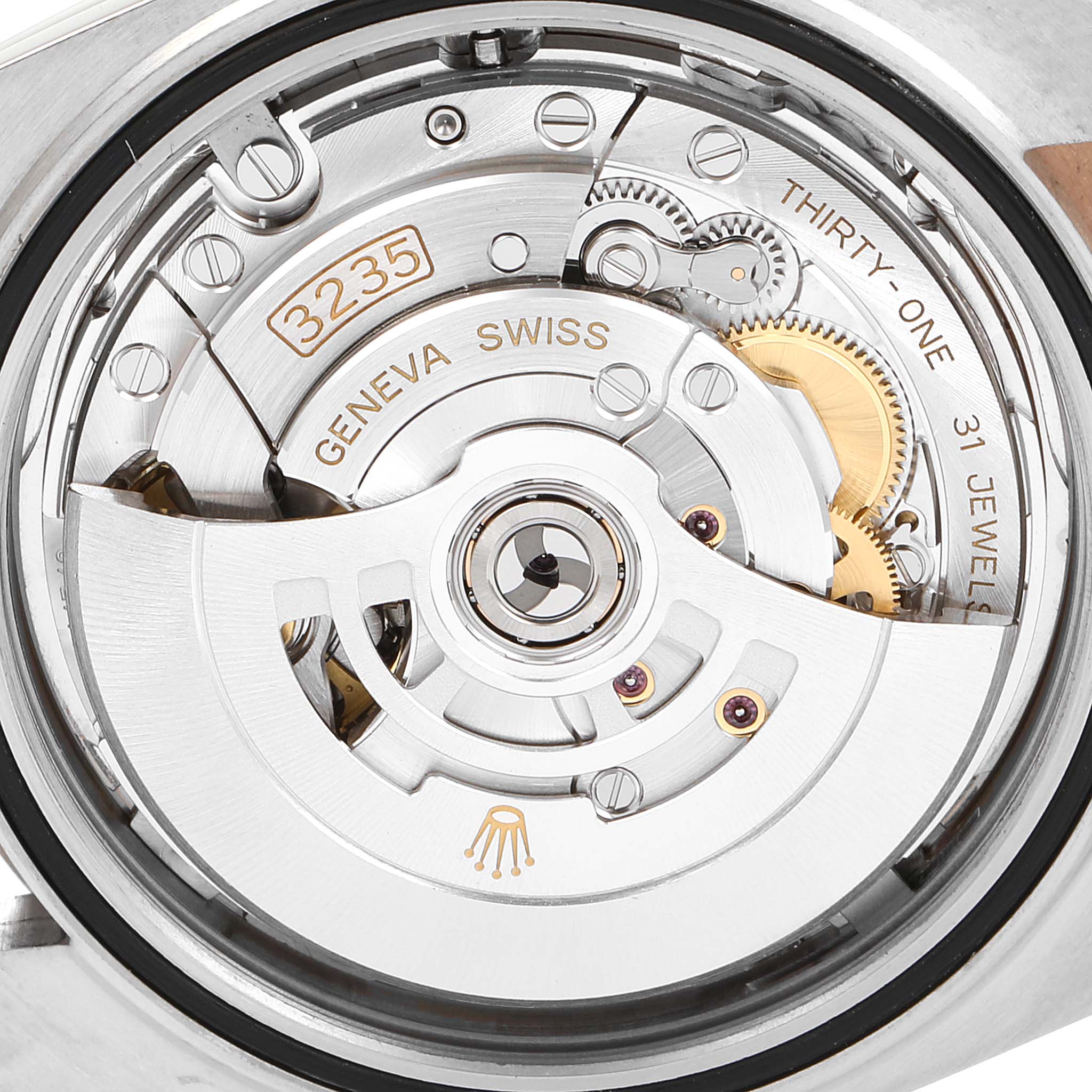 This is an image of the internal movement mechanism of a Rolex Datejust 41 126331 Men's Steel and Gold (two tone) Silver Dial 126331 Men's Steel and Gold (two tone) Silver Dial watch, showcasing the intricate parts and gears.