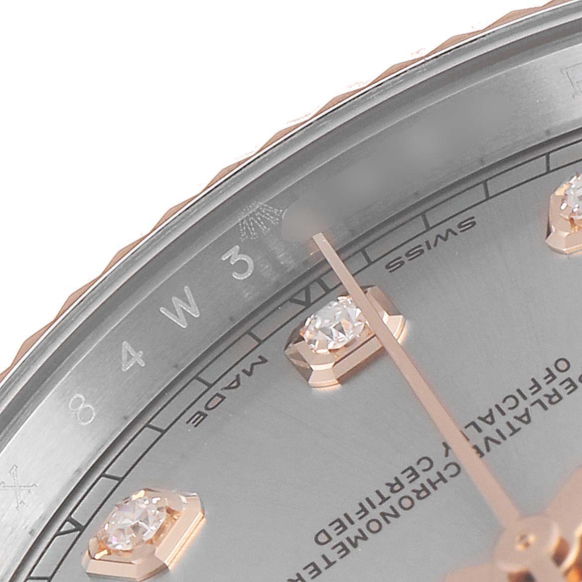 This is a close-up of the dial and markers of the Rolex Datejust 41 126331 Men's Steel and Gold (two tone) Silver Dial 126331 Men's Steel and Gold (two tone) Silver Dial watch, showing details of the hour markers and the Swiss Made text.