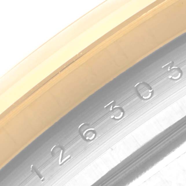 The image shows a close-up of the serial number on the bezel and edge of the dial of a Rolex Datejust 41 126303 Men's Steel and Gold (two tone) Grey Dial 126303 Men's Steel and Gold (two tone) Grey Dial watch.