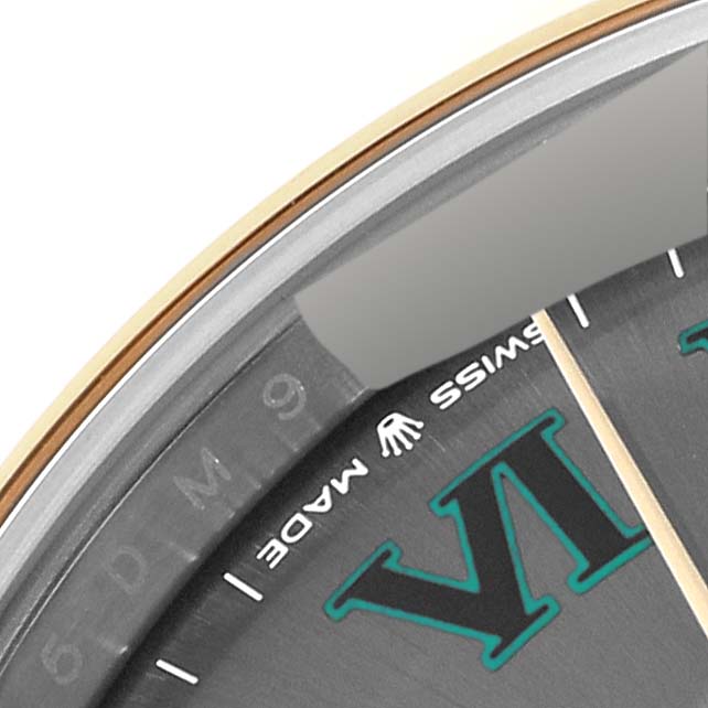 Close-up of a Rolex Datejust 41 126303 Men's Steel and Gold (two tone) Grey Dial 126303 Men's Steel and Gold (two tone) Grey Dial showing the dial, partial bezel, and text "Swiss Made" near 6 o'clock.