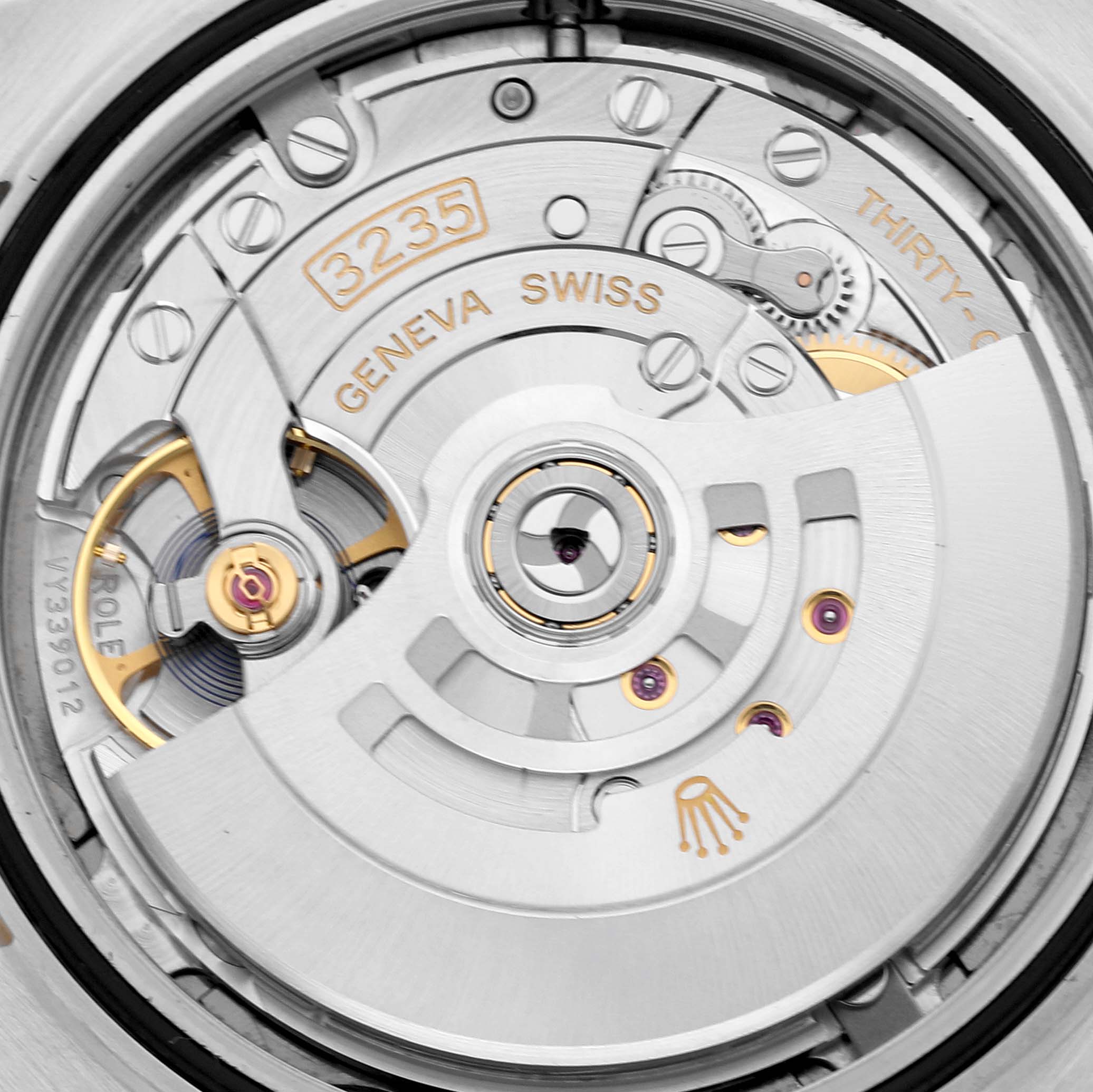This image shows a close-up of the Rolex Datejust 41 126303 Men's Steel and Gold (two tone) Grey Dial 126303 Men's Steel and Gold (two tone) Grey Dial movement, highlighting the intricate components and mechanism.