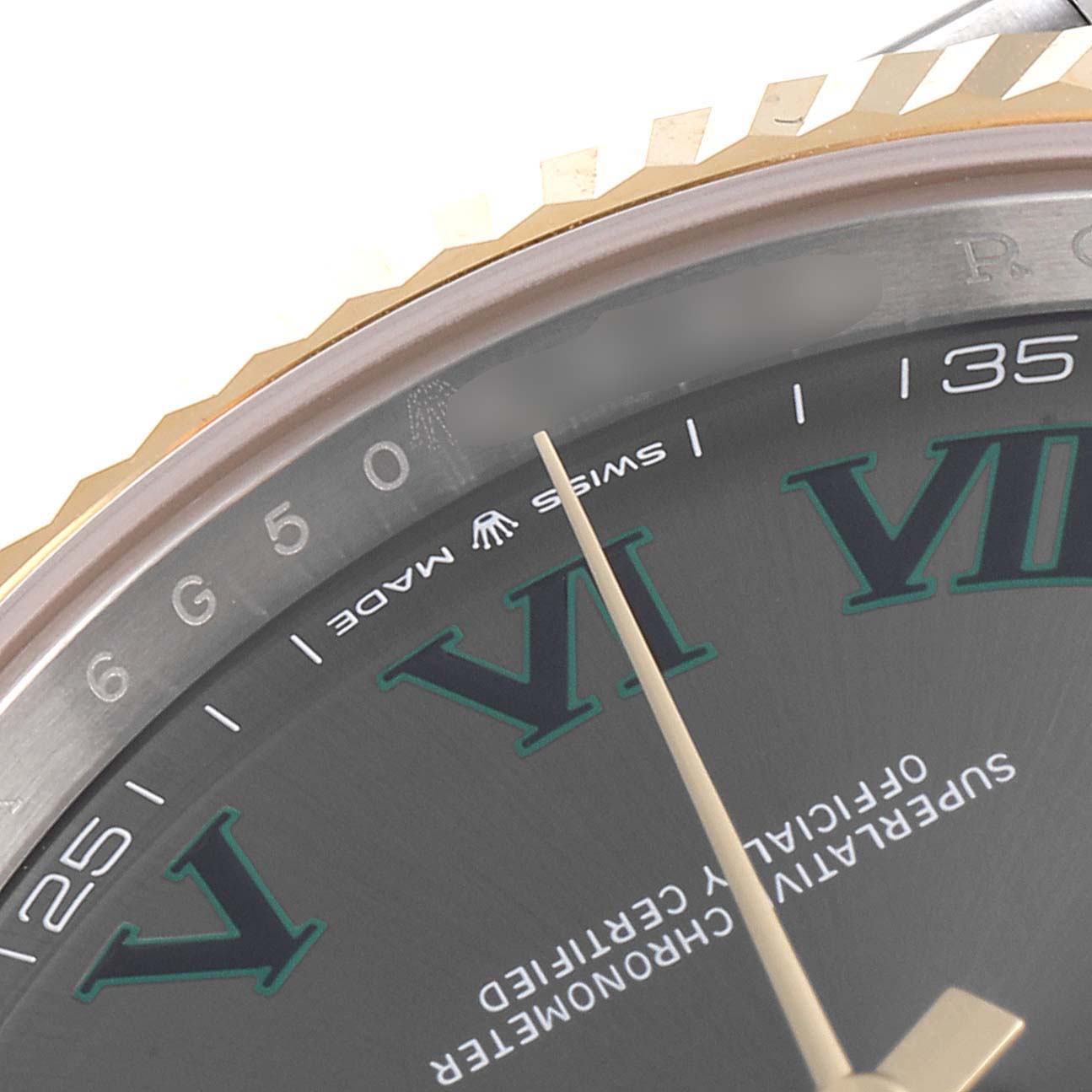 This is a close-up of the Rolex Datejust 41 126333 Men's Steel and Gold (two tone) Grey Dial 126333 Men's Steel and Gold (two tone) Grey Dial watch, showing part of the dial, bezel, and the "Swiss Made" inscription.