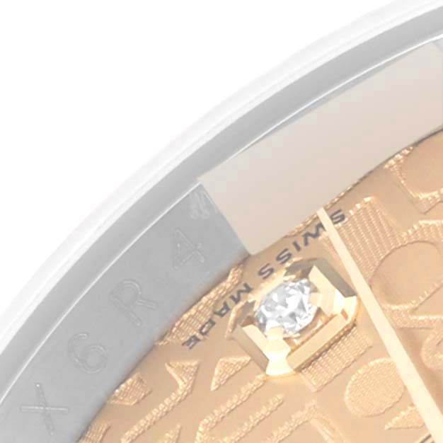 The image shows a close-up of the Rolex Datejust 116243 Men's Steel and Gold (two tone) Champagne Dial 116243 Men's Steel and Gold (two tone) Champagne Dial watch dial with a diamond marker and partial bezel.