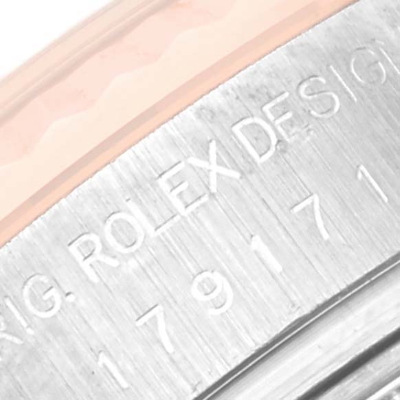 This image shows a close-up angle of the case side of a Rolex Datejust 179171 Women's Steel and Gold (two tone) Black Dial 179171 Women's Steel and Gold (two tone) Black Dial model, featuring etched engraving.