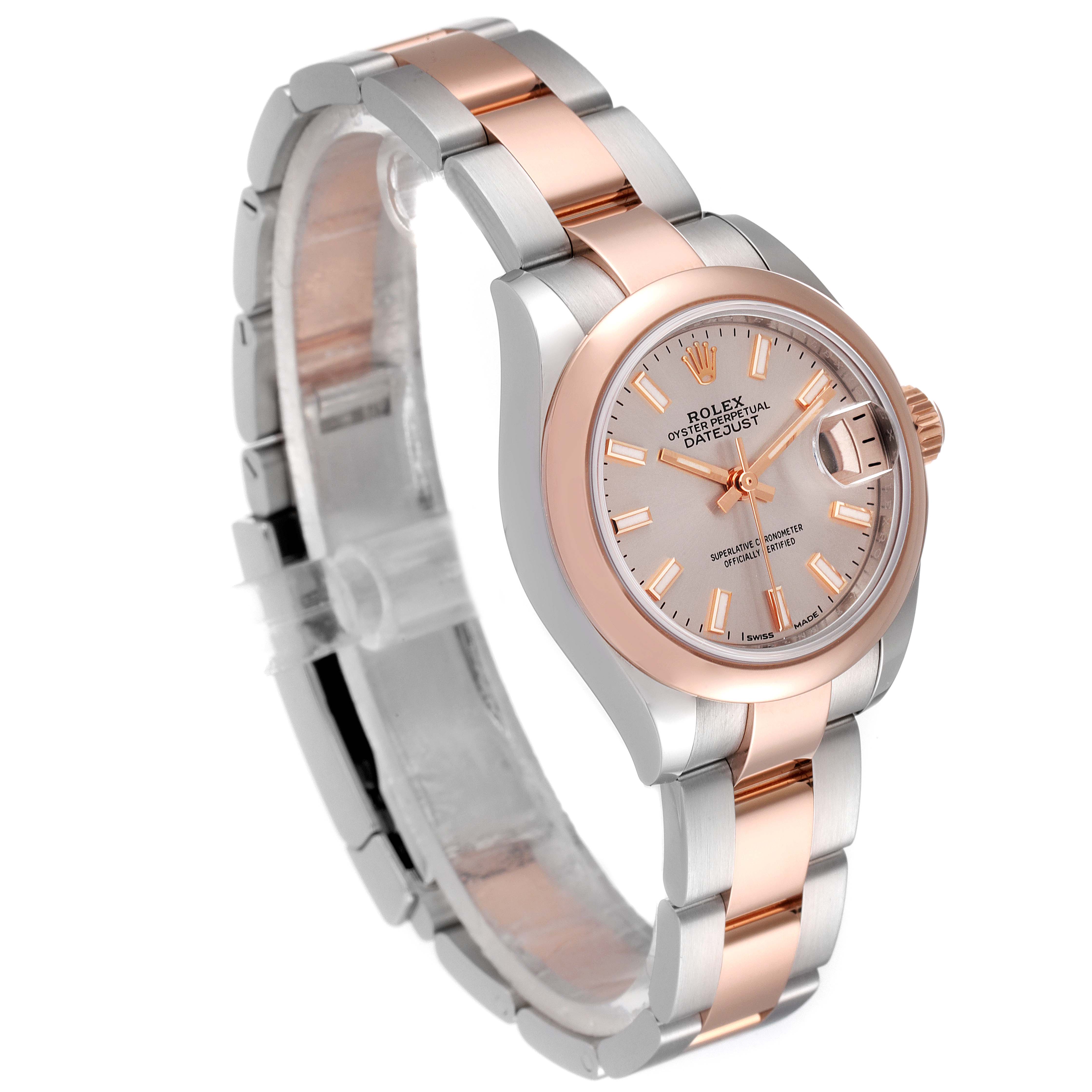 This image shows a Rolex Datejust 279161 Women's Steel and Gold (two tone) Pink Dial 279161 Women's Steel and Gold (two tone) Pink Dial watch at a three-quarter angle, highlighting its dial, bezel, and bracelet.