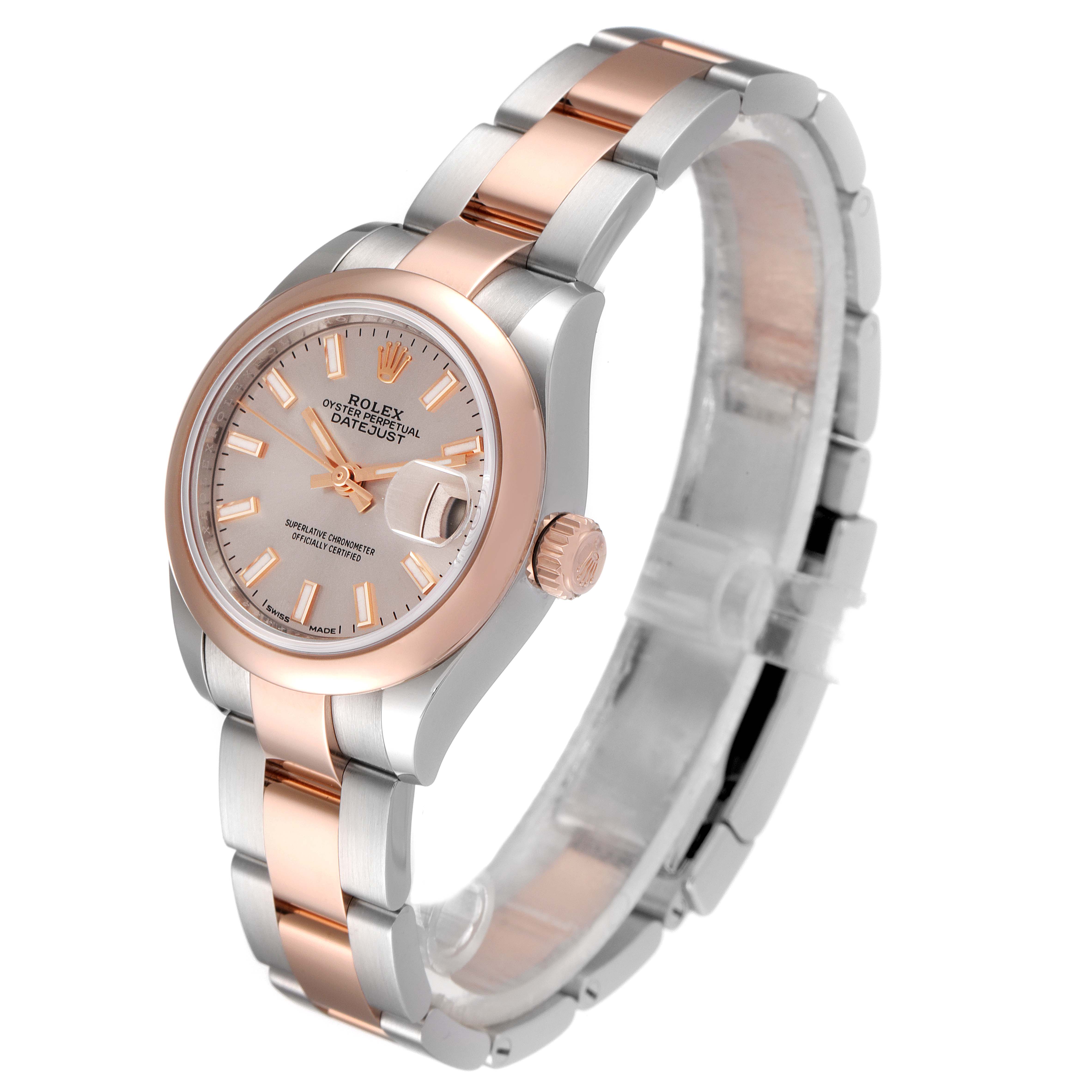 The image shows an angled view of the Rolex Datejust 279161 Women's Steel and Gold (two tone) Pink Dial 279161 Women's Steel and Gold (two tone) Pink Dial watch, highlighting the dial, bezel, and two-tone bracelet.