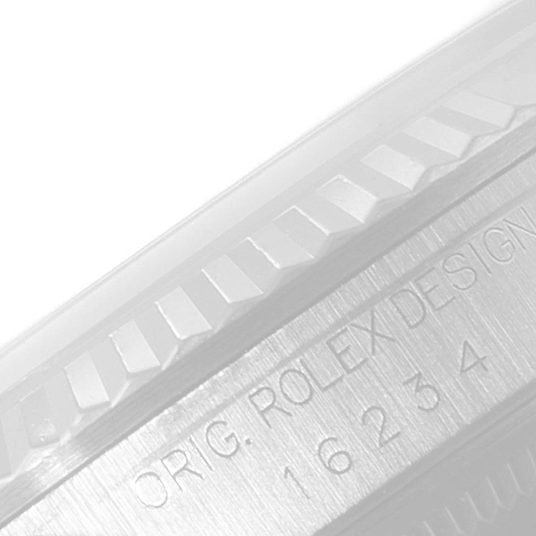 The image shows a close-up of the side of a Rolex Datejust 16234 Men's Stainless Steel Silver Dial 16234 Men's Stainless Steel Silver Dial watch, featuring the model number 16234 and "Orig. Rolex Design" engraved on the bezel.