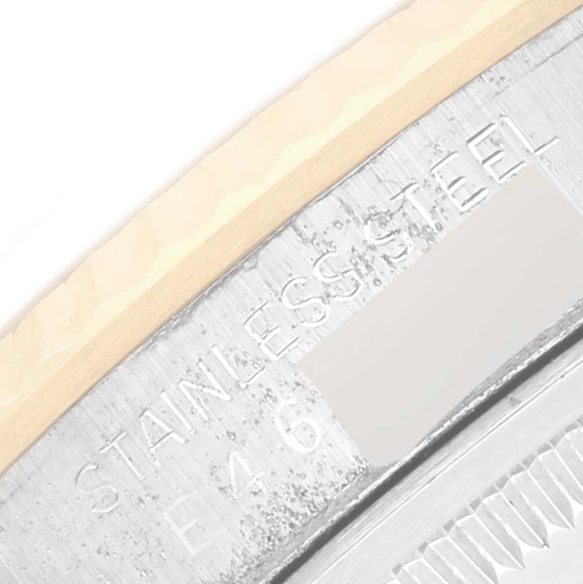 The image shows a close-up of the side engraving on a Rolex Datejust 16233 Men's Steel and Gold (two tone) Champagne Dial case with "STAINLESS STEEL" visible.