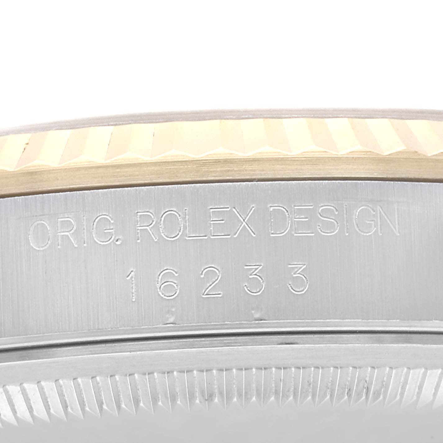 This is a close-up of the case side of a Rolex Datejust 16233NR Men's Steel and Gold (two tone) Mother of Pearl Dial 16233NR Men's Steel and Gold (two tone) Mother of Pearl Dial, showing the model number and design engraving.