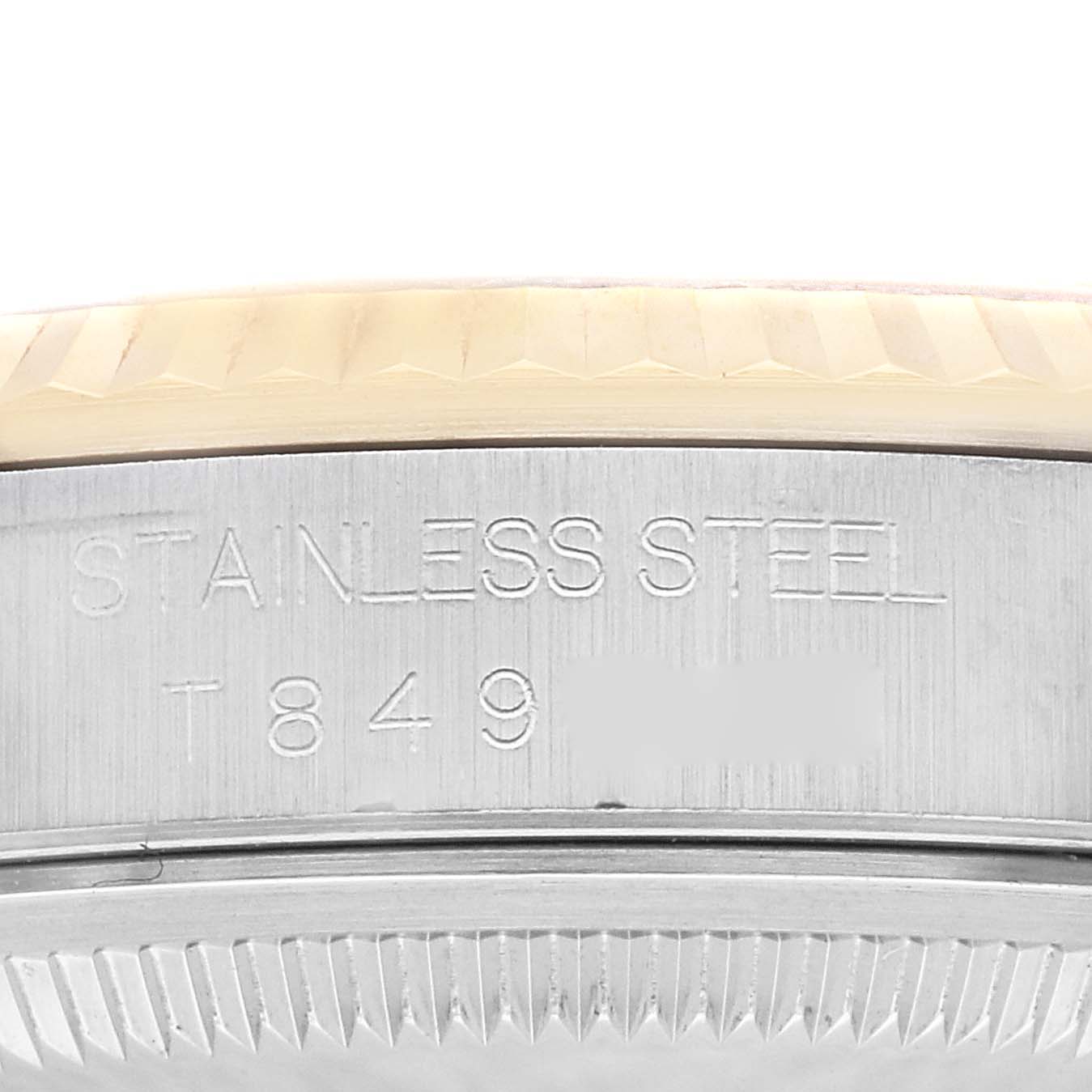 This image shows a close-up of the stainless steel casing and part of the bezel of a Rolex Datejust 16233NR Men's Steel and Gold (two tone) Mother of Pearl Dial 16233NR Men's Steel and Gold (two tone) Mother of Pearl Dial watch.