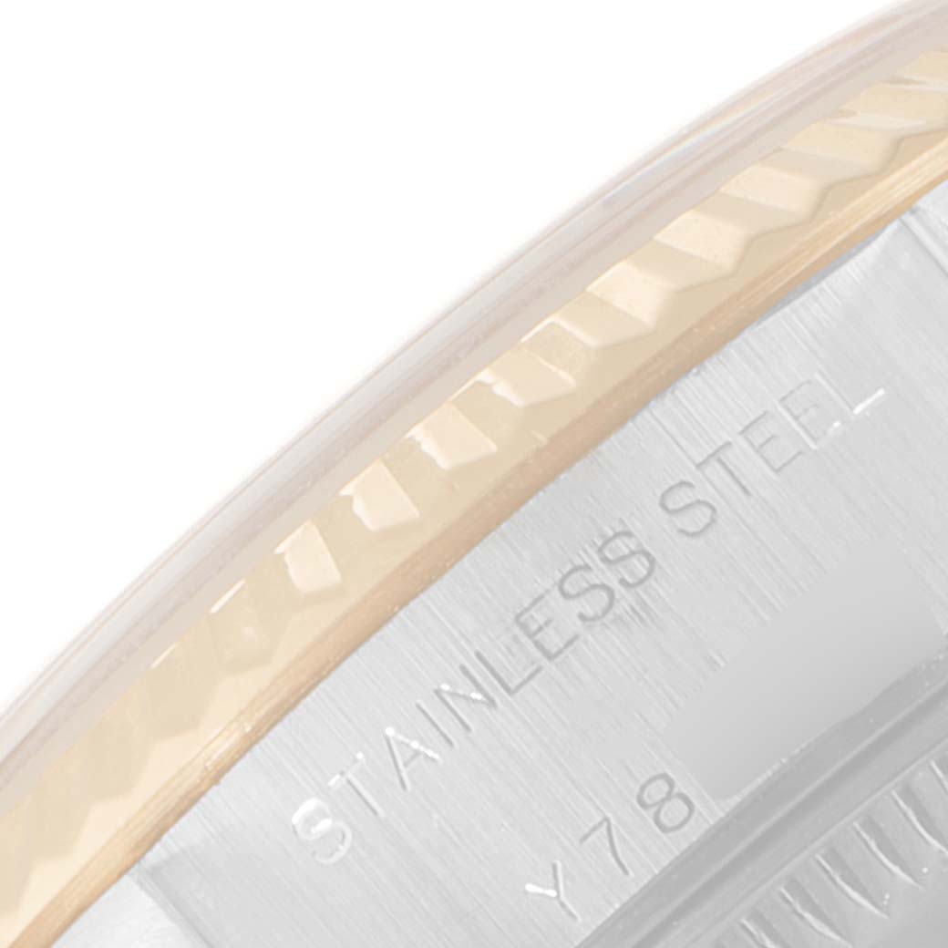 This close-up image shows the stainless steel casing and part of the fluted bezel on a Rolex Datejust 79173 Women
s Steel and Gold (two tone) Silver Dial 79173 Women
s Steel and Gold (two tone) Silver Dial watch.